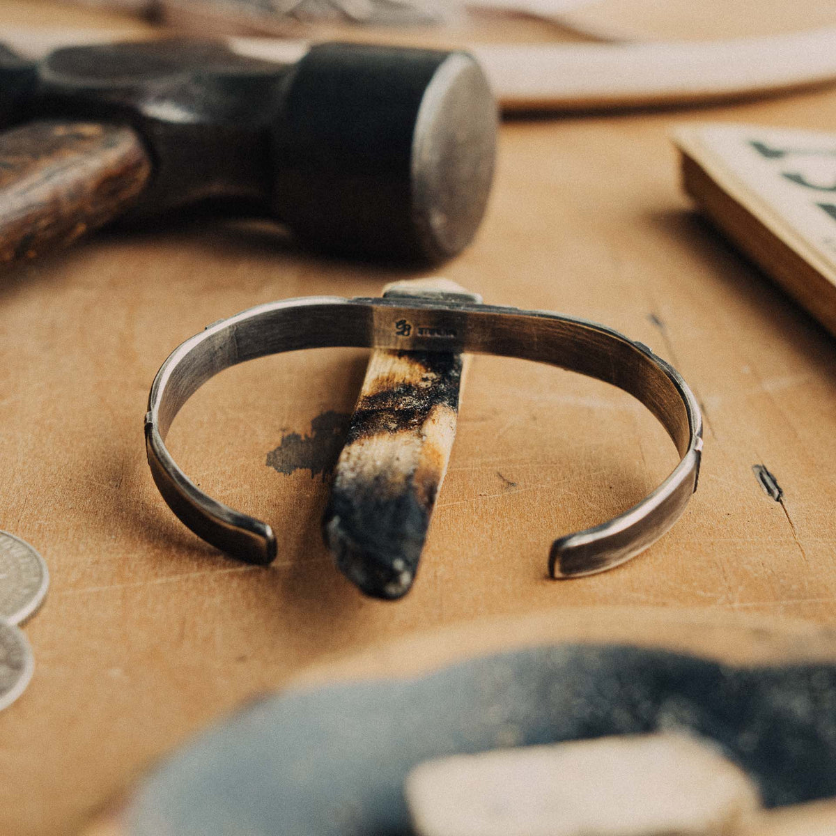 A hand-wrought sterling silver stacking cuff set with a rectangular Royston turquoise stone, its soft blue-green face with subtle dark matrix, placed in a smooth straight bezel — view 3