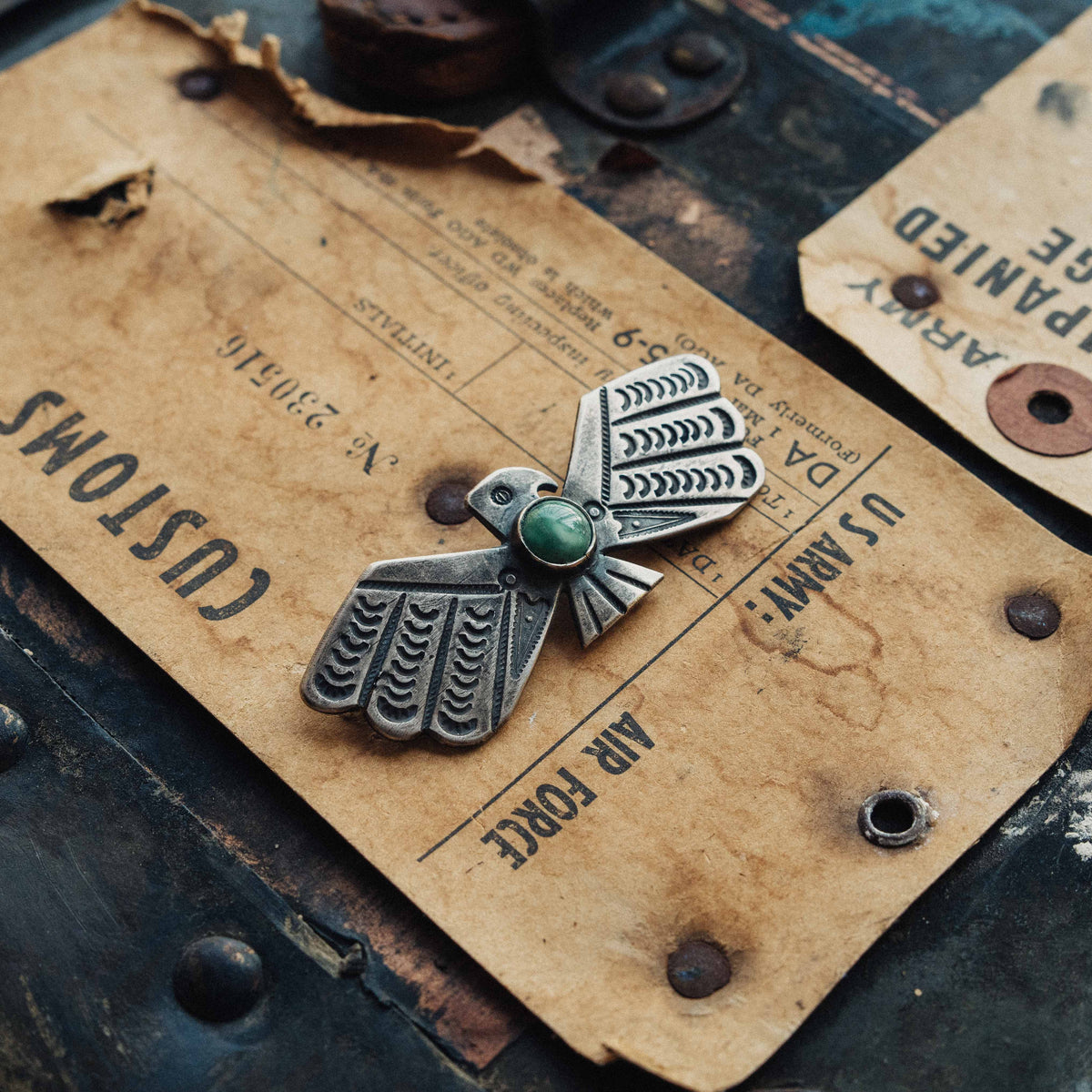 A handwrought sterling silver Thunderbird with wings outstretched, centered on a round Fox turquoise stone set in a smooth straight bezel — view 2