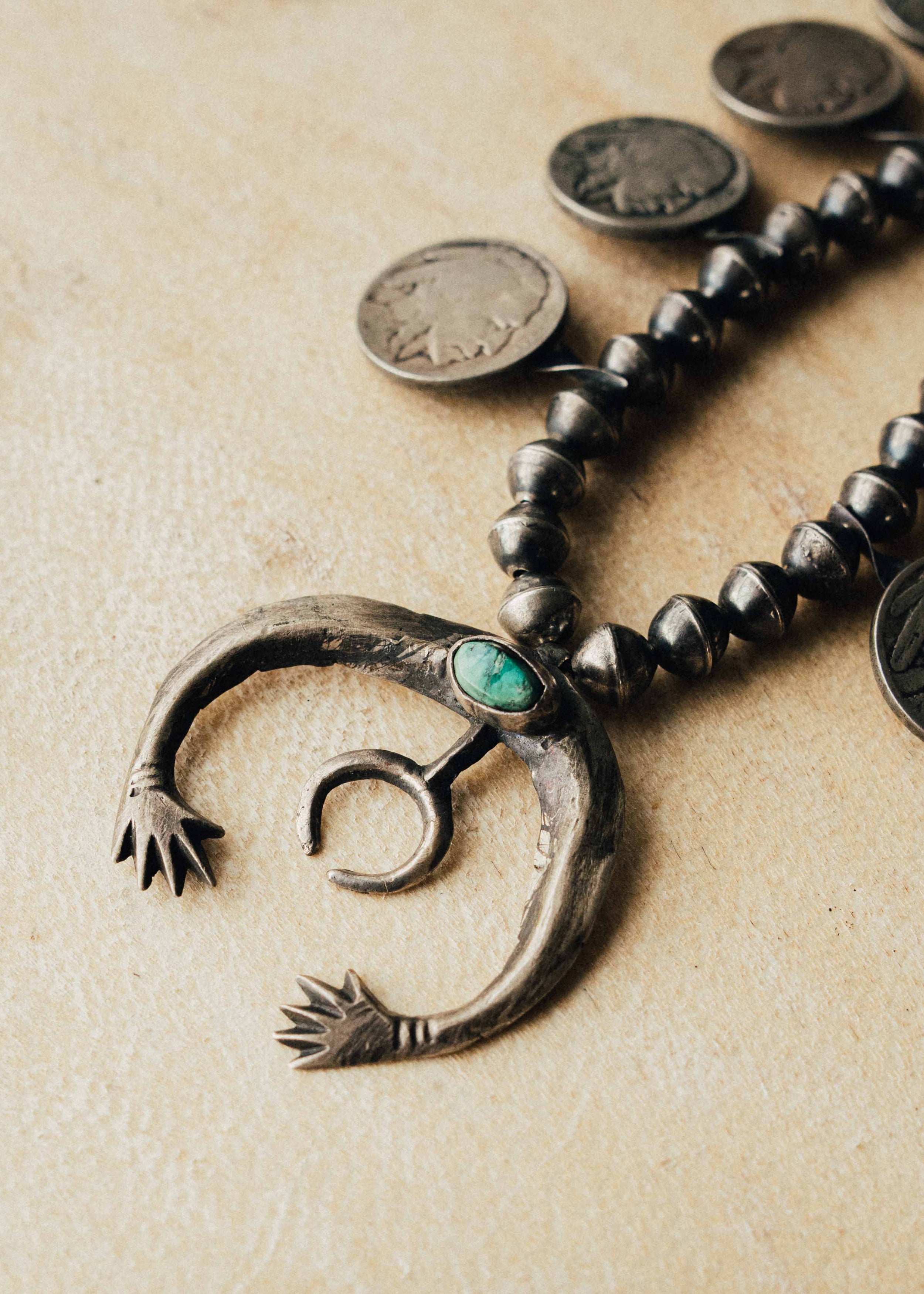 A 1940s squash blossom — green turquoise on a sandcast Naja, handmade Navajo pearls, and ten buffalo nickels with decades of natural patina — view 2