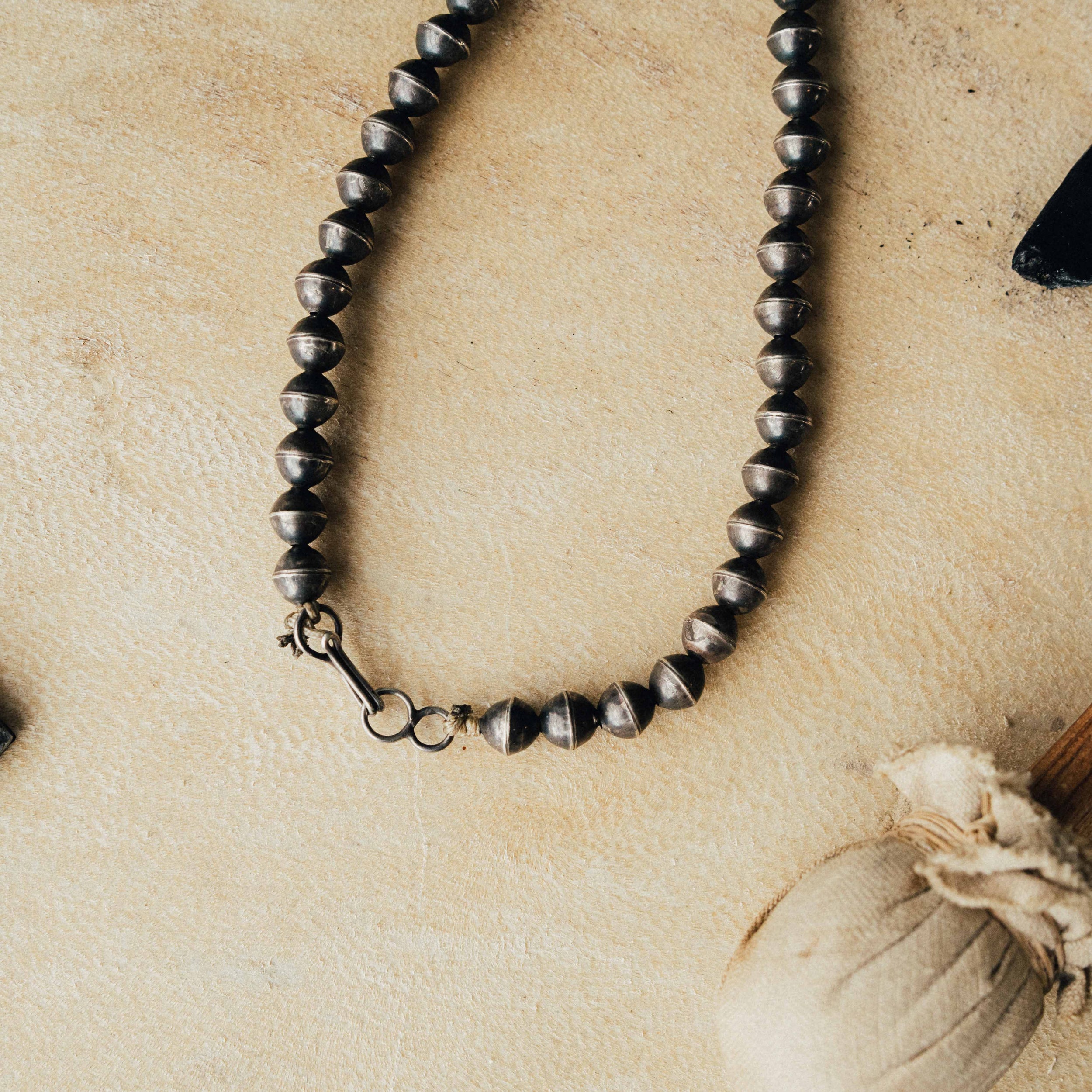 A 1940s squash blossom — green turquoise on a sandcast Naja, handmade Navajo pearls, and ten buffalo nickels with decades of natural patina — view 3