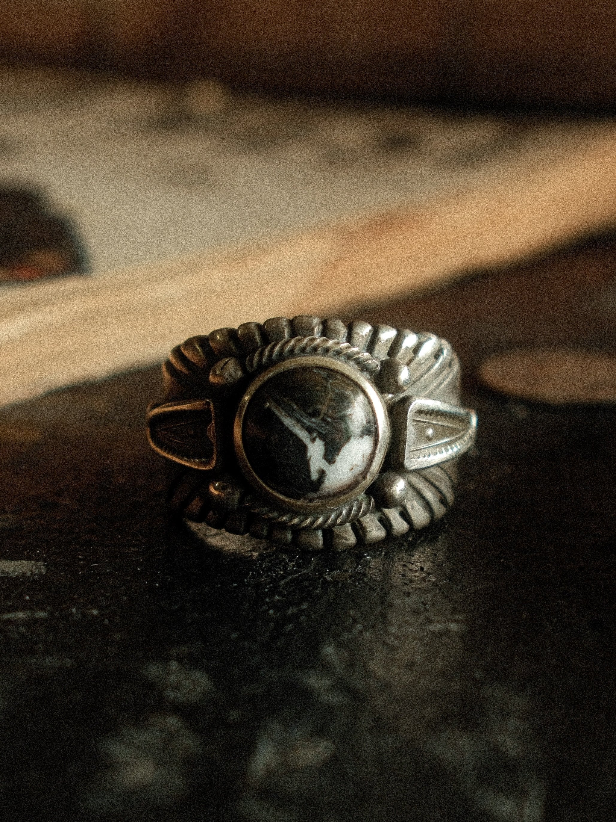 Premium White Buffalo from its single Nevada source on a heavy sterling Chief ring with hand-struck side detail