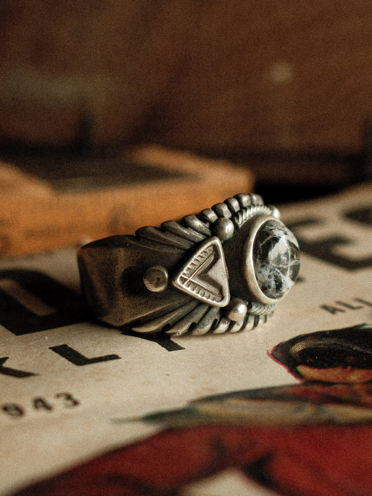 A premium 10mm White Buffalo stone on a heavy sterling Chief ring with hand-struck side detailing. — view 2