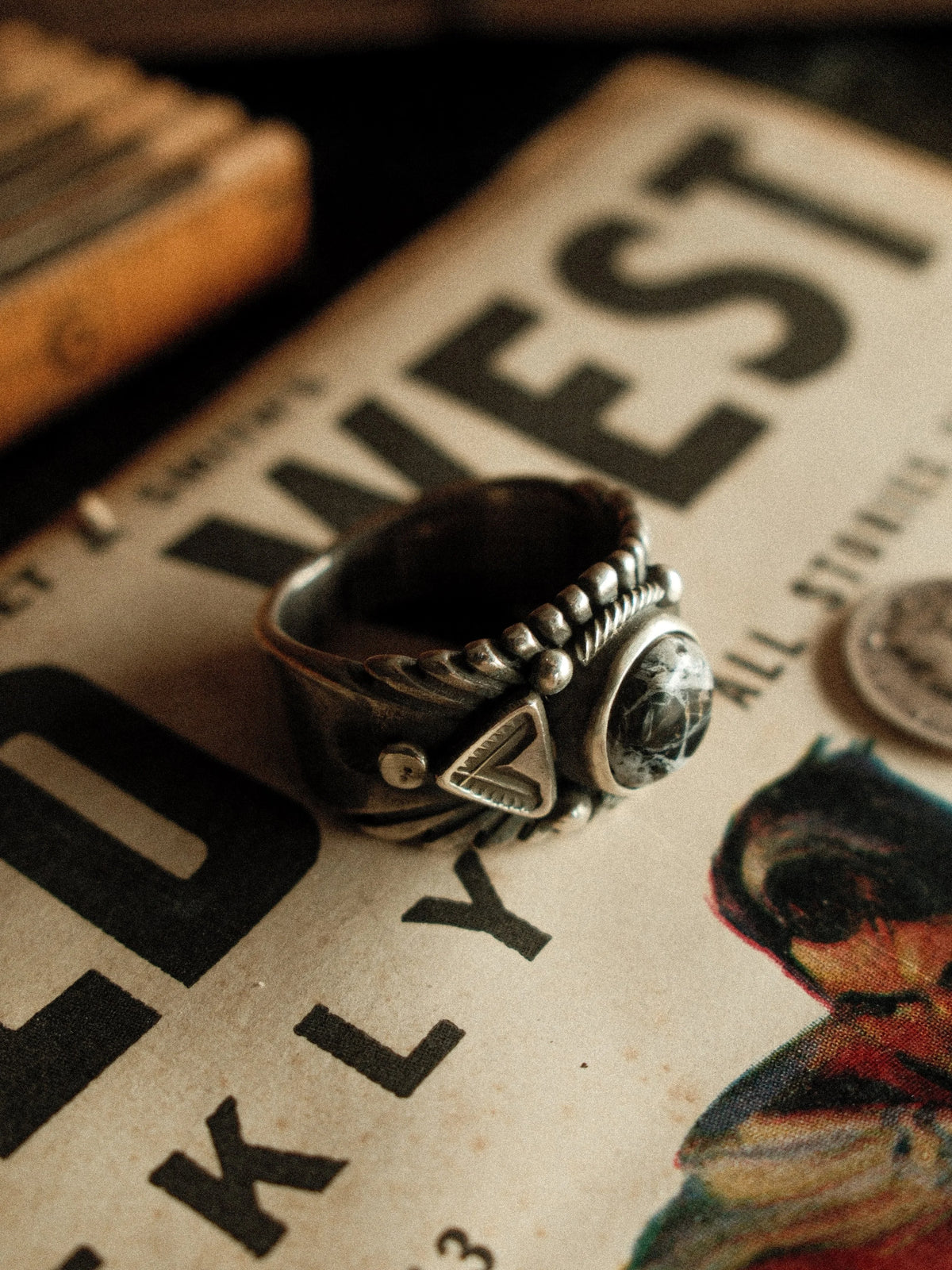 A premium 10mm White Buffalo stone on a heavy sterling Chief ring with hand-struck side detailing. — view 3