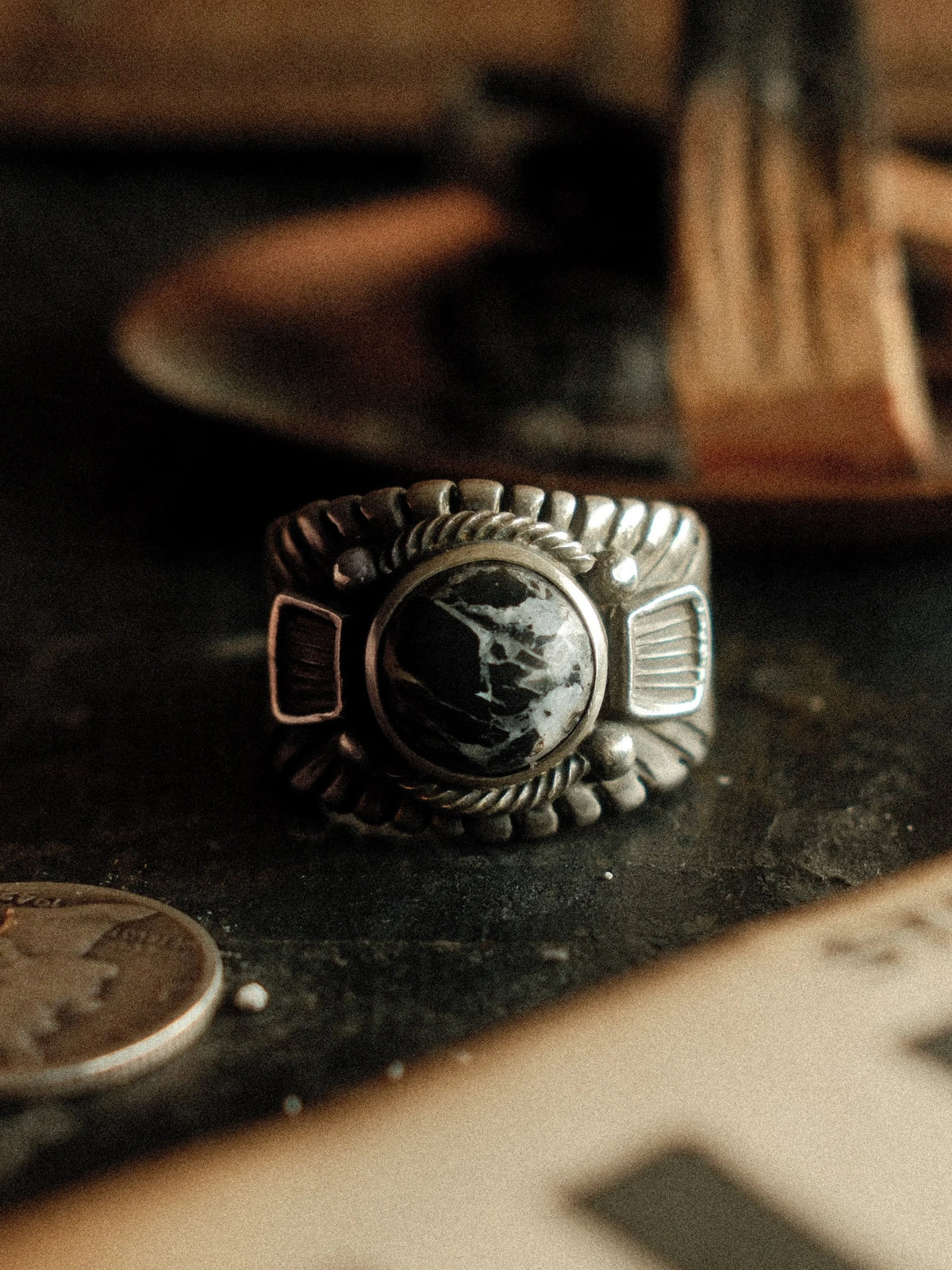 A premium 10mm White Buffalo stone on a heavy sterling Chief ring with hand-struck side detailing.