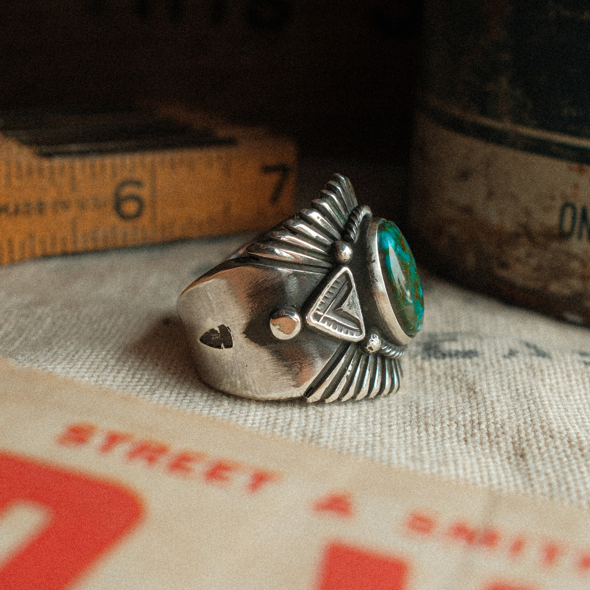 A high-grade Kingman Water Web turquoise cabochon set in a smooth bezel, framed by hand-stamped rays that fan out like a headdress — view 3