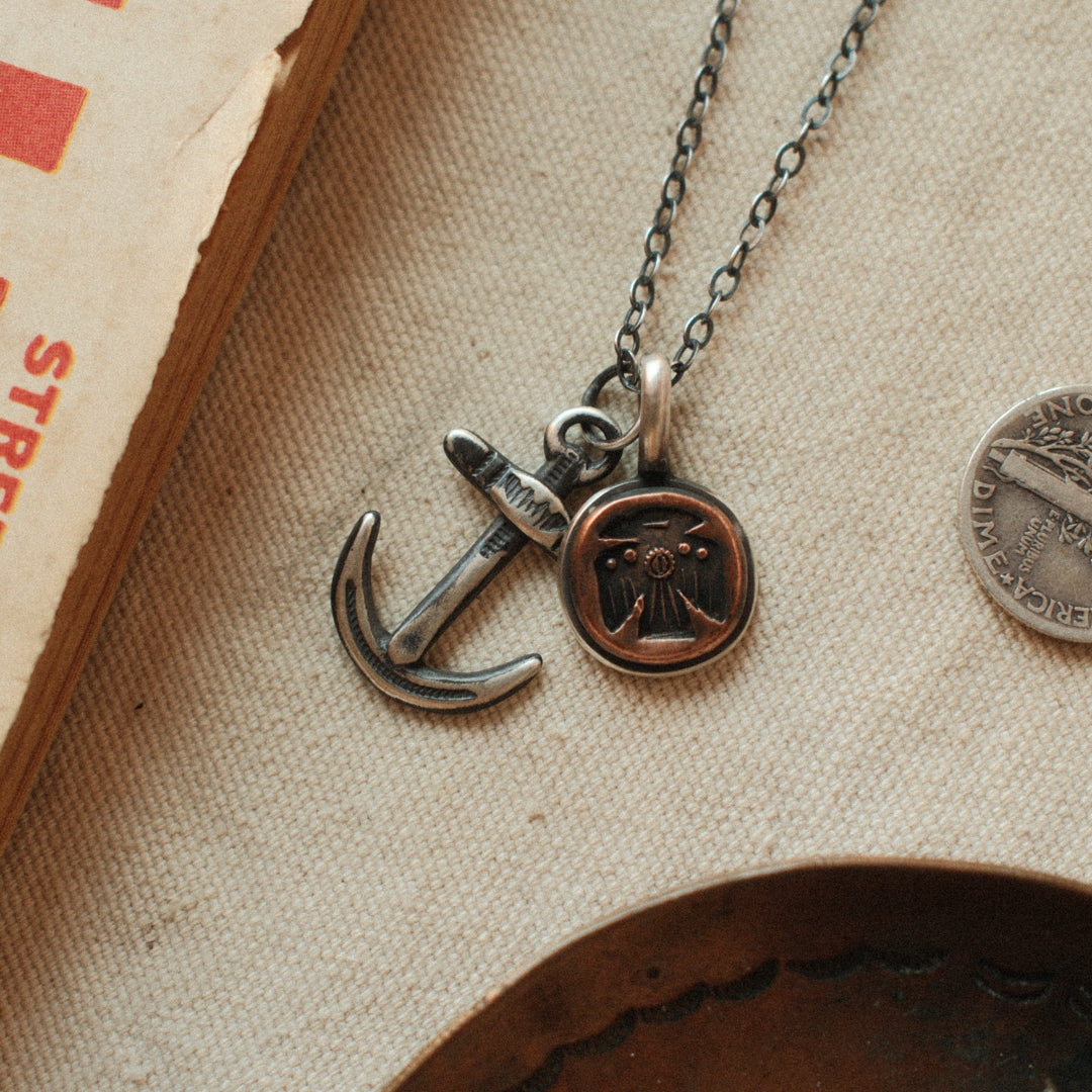 A lightweight sterling silver cable chain with flat oval links in 16 to 20 inch lengths, finished with a lobster clasp and a hand-applied patina.