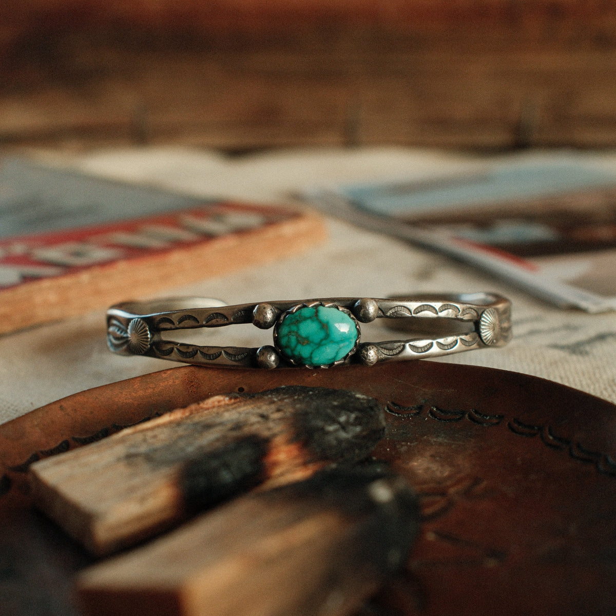 A one-of-a-kind tufa-cast split cuff with an 8×12mm Fox turquoise in a hand filed serrated bezel, between silver beads on twin bars — view 3