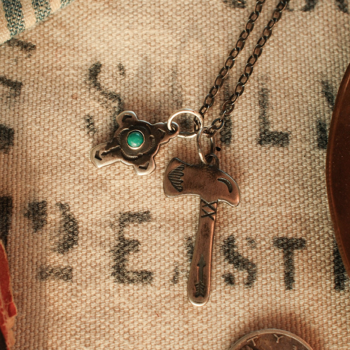 A fine sterling silver cable chain with flat oval links — a lighter foundation for smaller pendants, finished with a hand-applied patina.