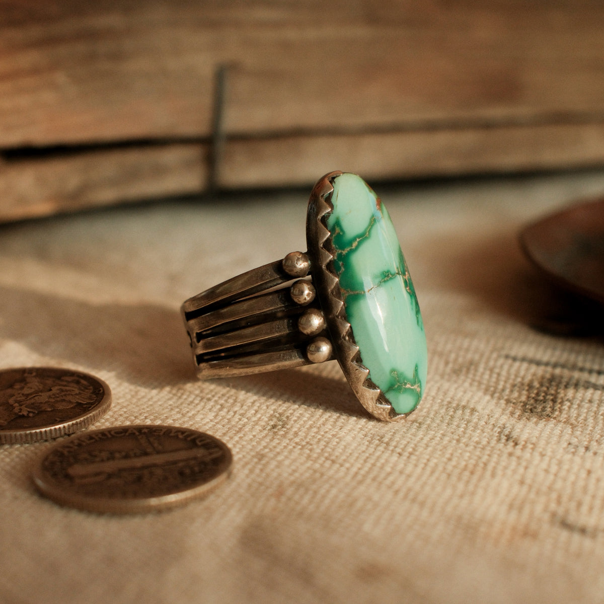 A one-of-a-kind 12×26mm Fox turquoise in a hand filed serrated bezel on a four-prong split shank with stacked silver beads — view 2