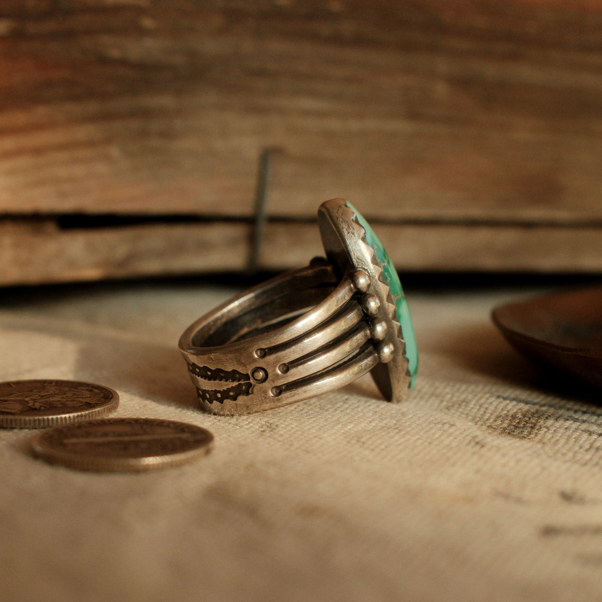 A one-of-a-kind 12×26mm Fox turquoise in a hand filed serrated bezel on a four-prong split shank with stacked silver beads — view 3