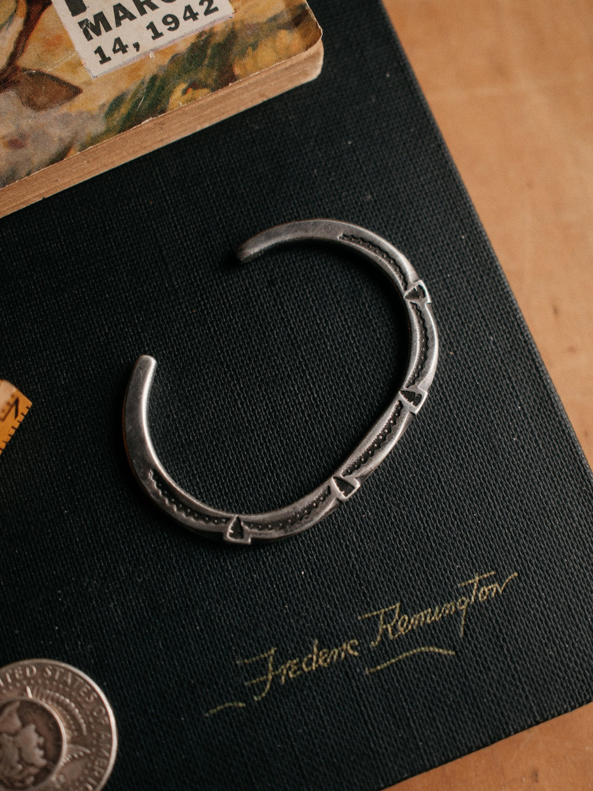 A tufa-cast coin-silver ingot cuff, intricately hand-stamped with Chad's own steel and left in its raw casting texture — view 3