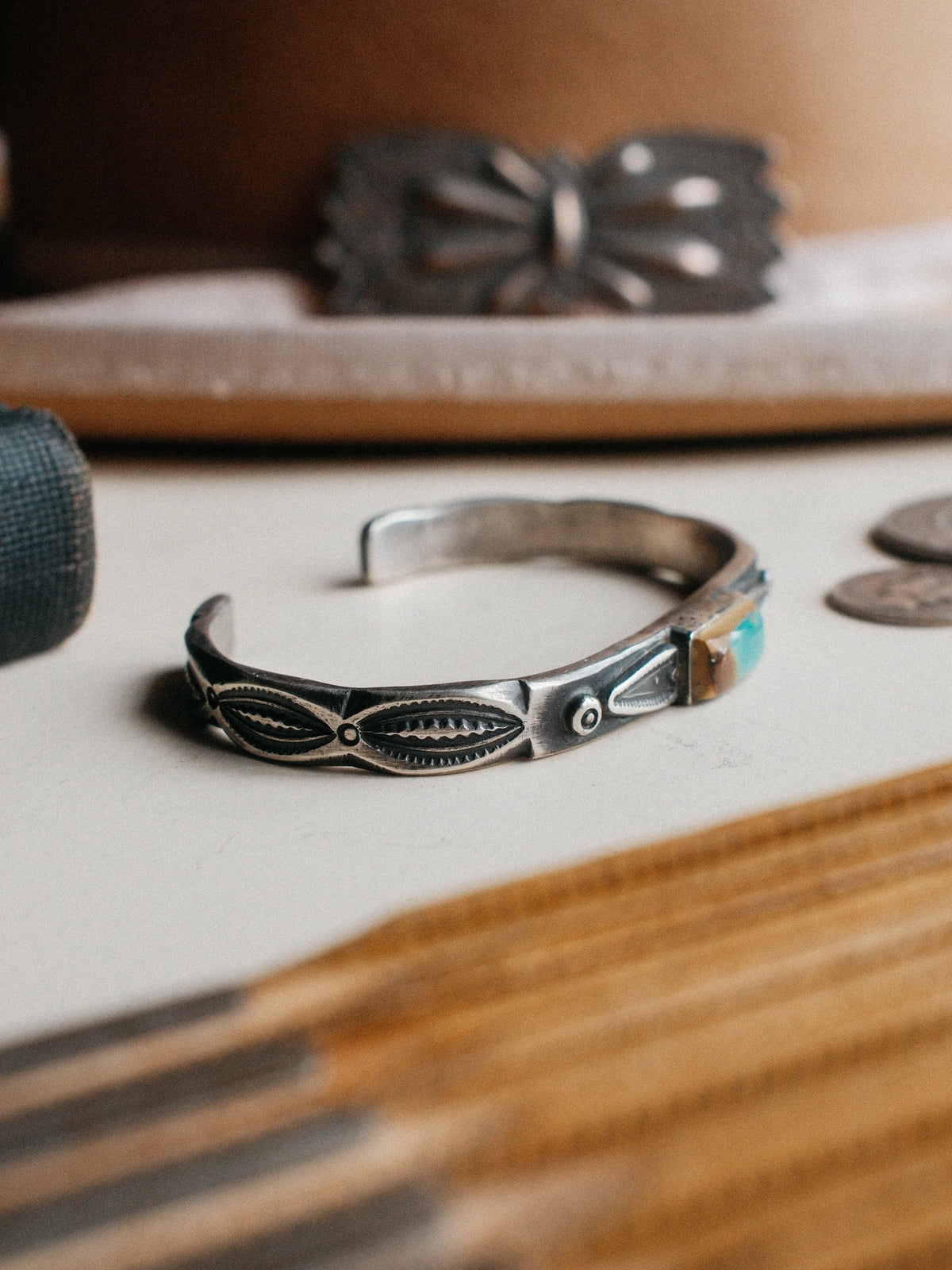 Poured from a tufa-cast ingot and hand-stamped with Chad's own steel, set with a piece of Royston turquoise — view 2