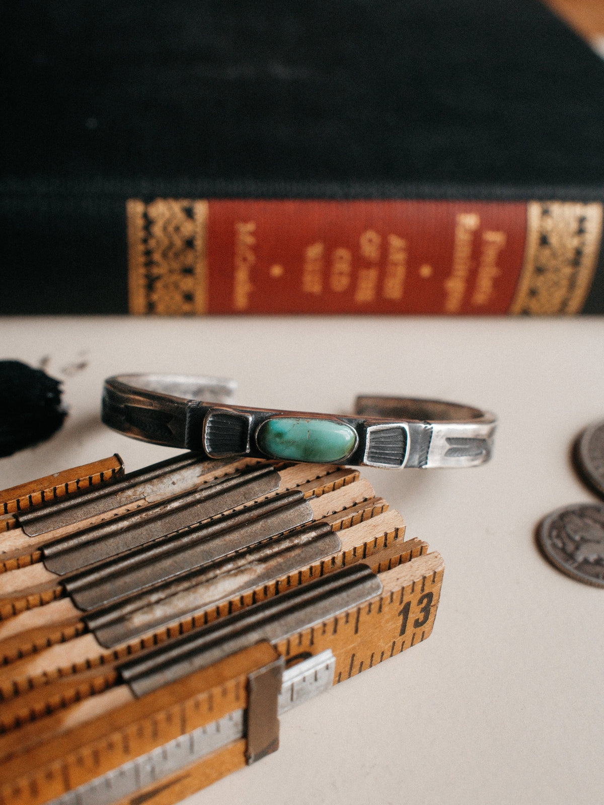 Tufa-cast in coin silver and hand-stamped throughout, set with Royston turquoise