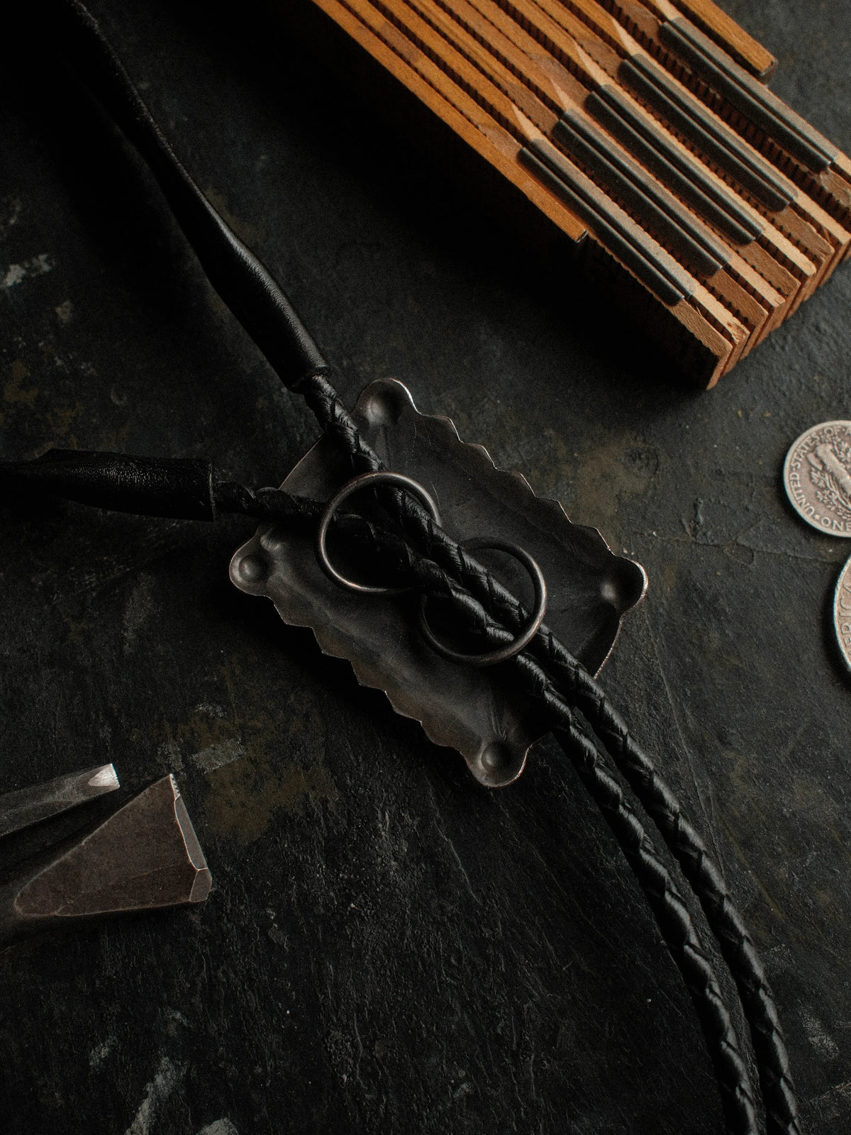 A Royston turquoise bolo, hand-stamped for dimension and set on braided leather with sterling end tips — view 3