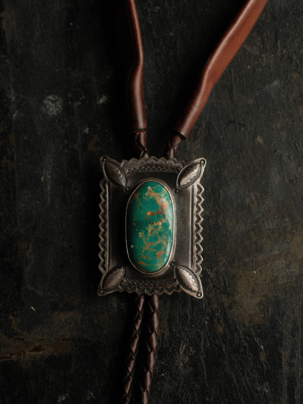 Royston turquoise on a hand-stamped slide with bump-out detailing, set on braided leather with sterling tips — view 2