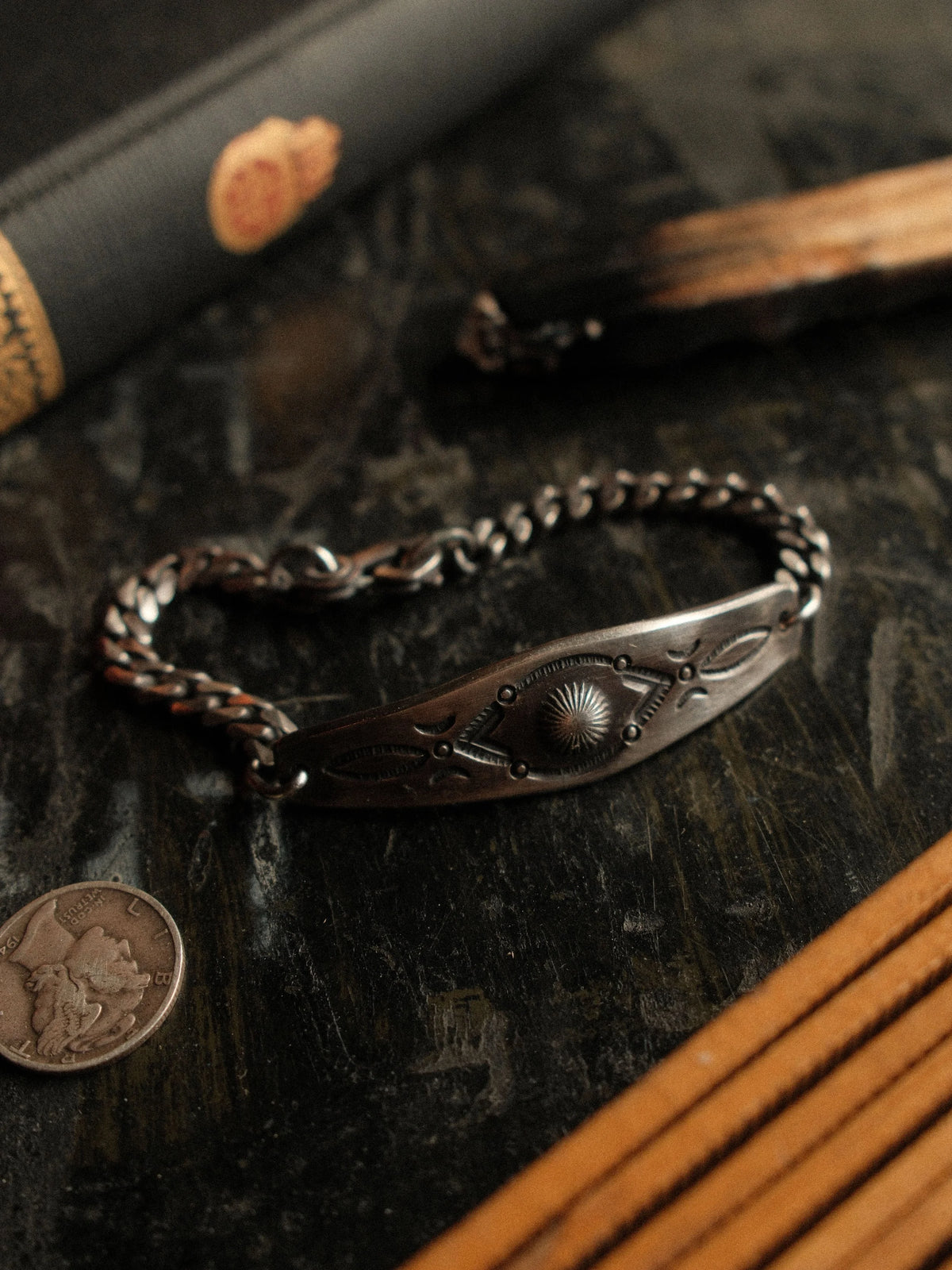 A hand-stamped ID plate set on a sturdy curb chain with our sister-hook clasp and finished in a deep patina — view 2