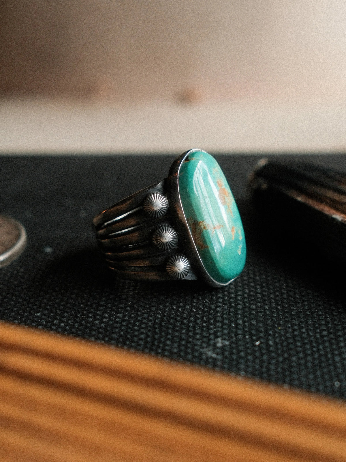 A 12×21mm Royston turquoise stone on a six-prong split shank with concho details, hand-stamped. — view 2