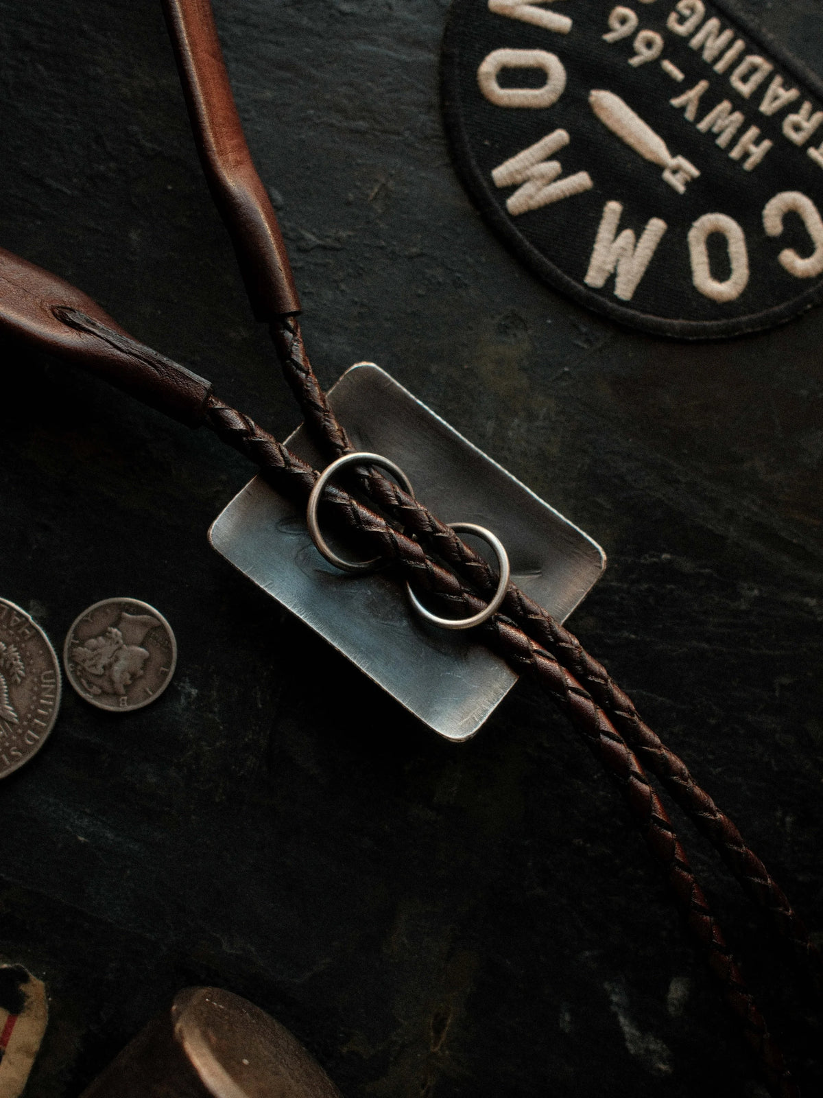 Royston turquoise from Nevada, hand-stamped for dimension and set on a braided leather cord with sterling tips — view 2