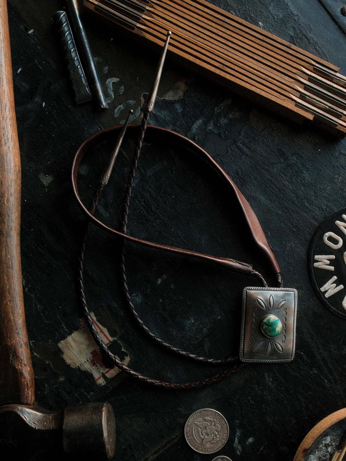Royston turquoise from Nevada, hand-stamped for dimension and set on a braided leather cord with sterling tips — view 3