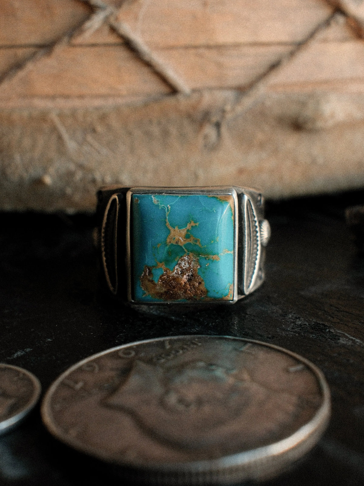 A tiered Bandolero ring hand-stamped with Chad's own steel and set with a piece of Kingman turquoise