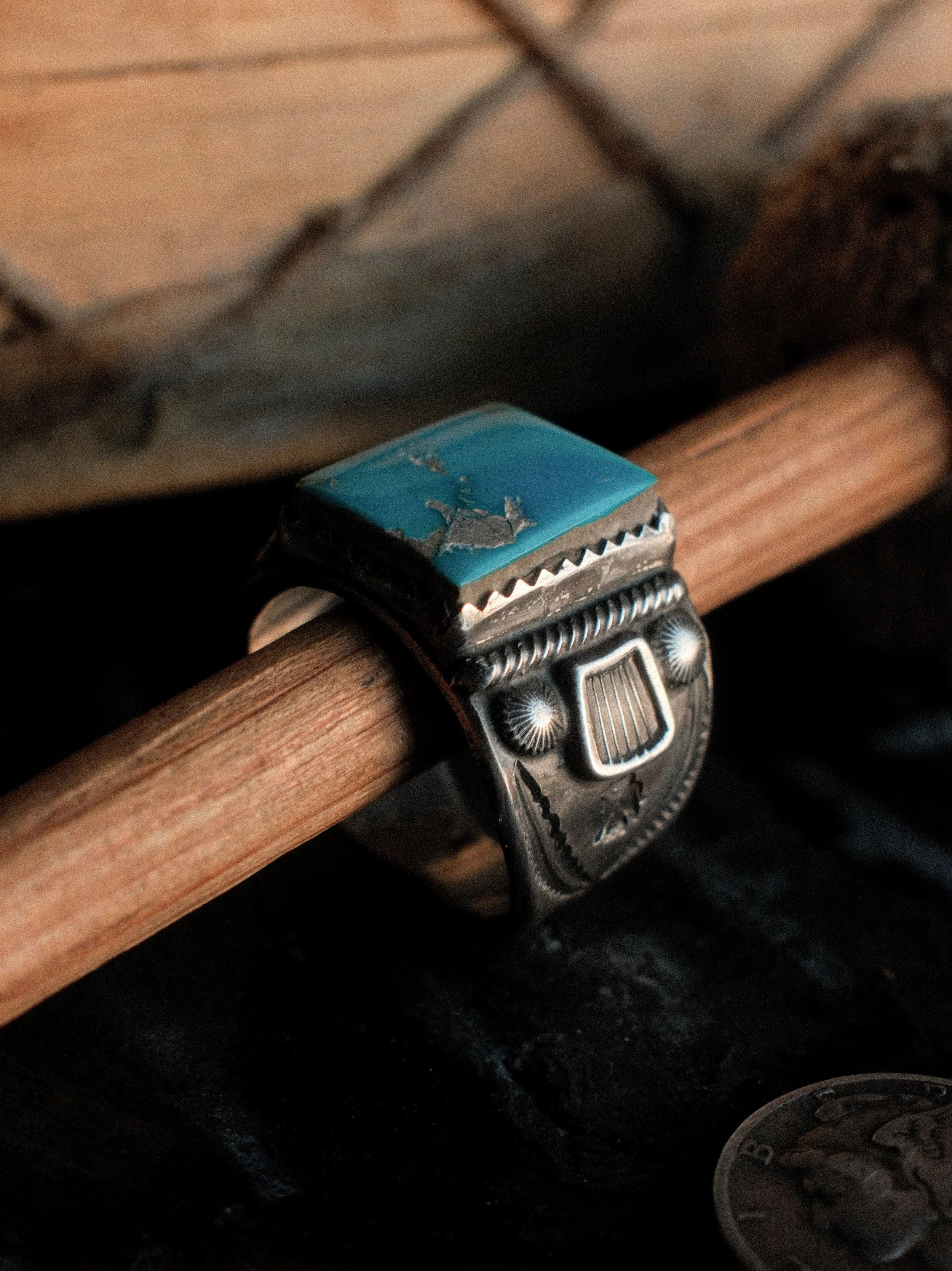 Kingman turquoise in a hand-filed serrated bezel on a tiered sterling base, hand-stamped — view 3