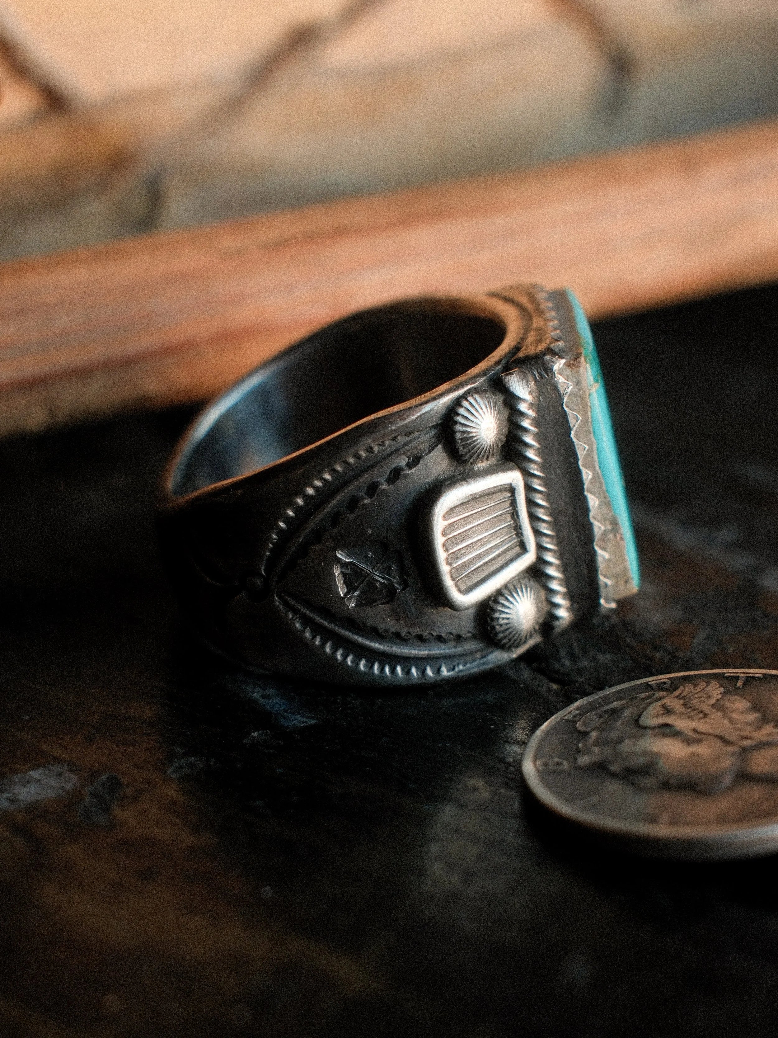 Kingman turquoise in a hand-filed serrated bezel on a tiered sterling base, hand-stamped — view 2