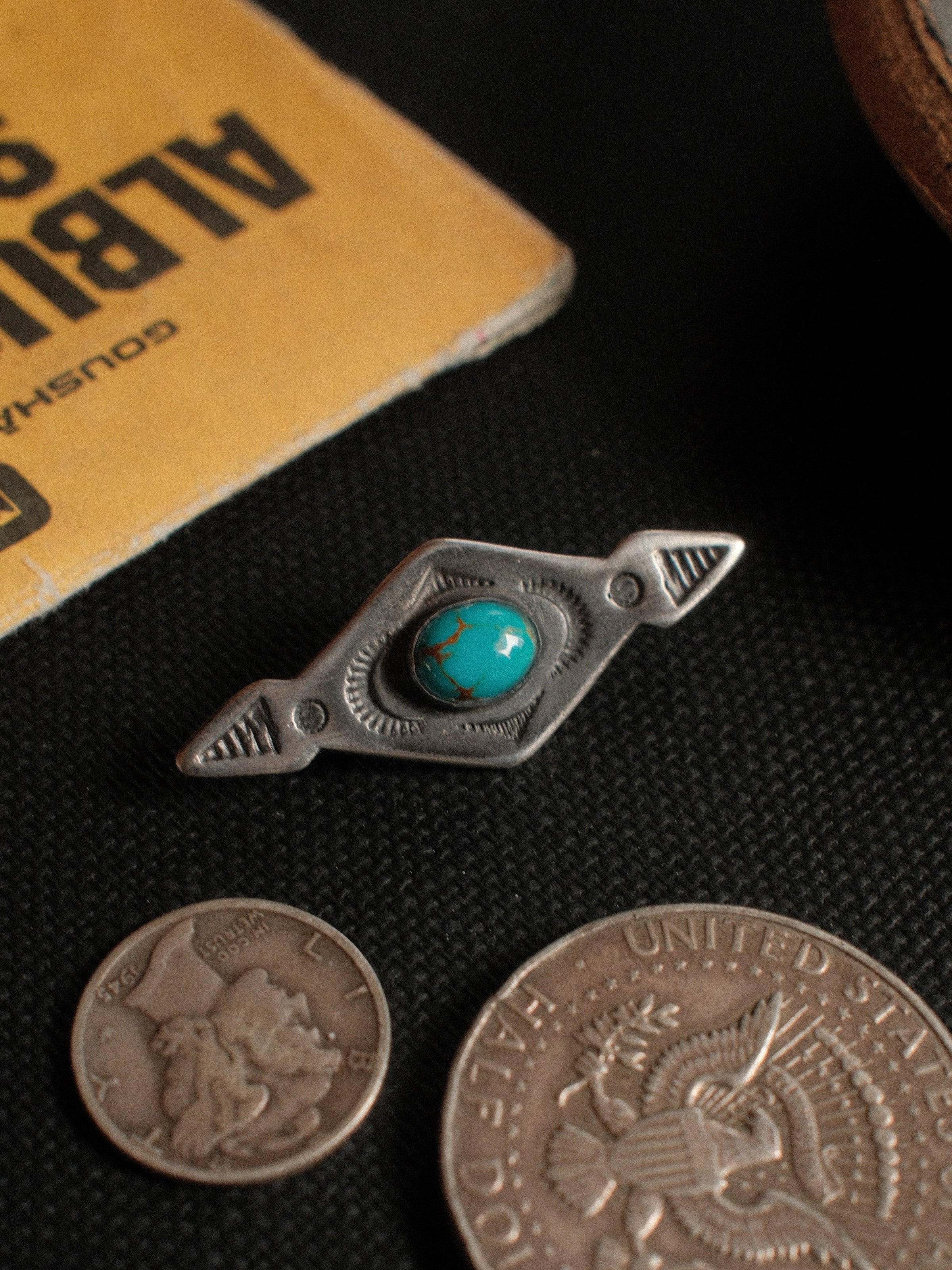 A vintage-inspired sterling silver pin set with Royston turquoise from Nevada