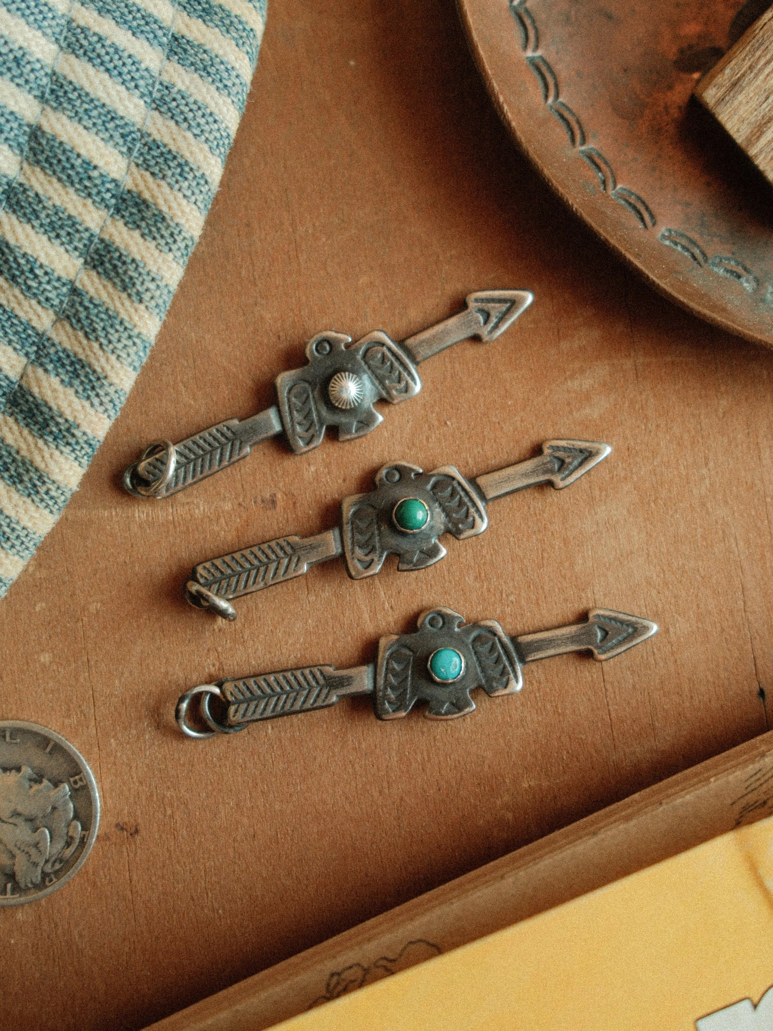 Arrow and thunderbird joined in fine sterling stampwork, centered with Carico Lake turquoise or a silver concho — view 5