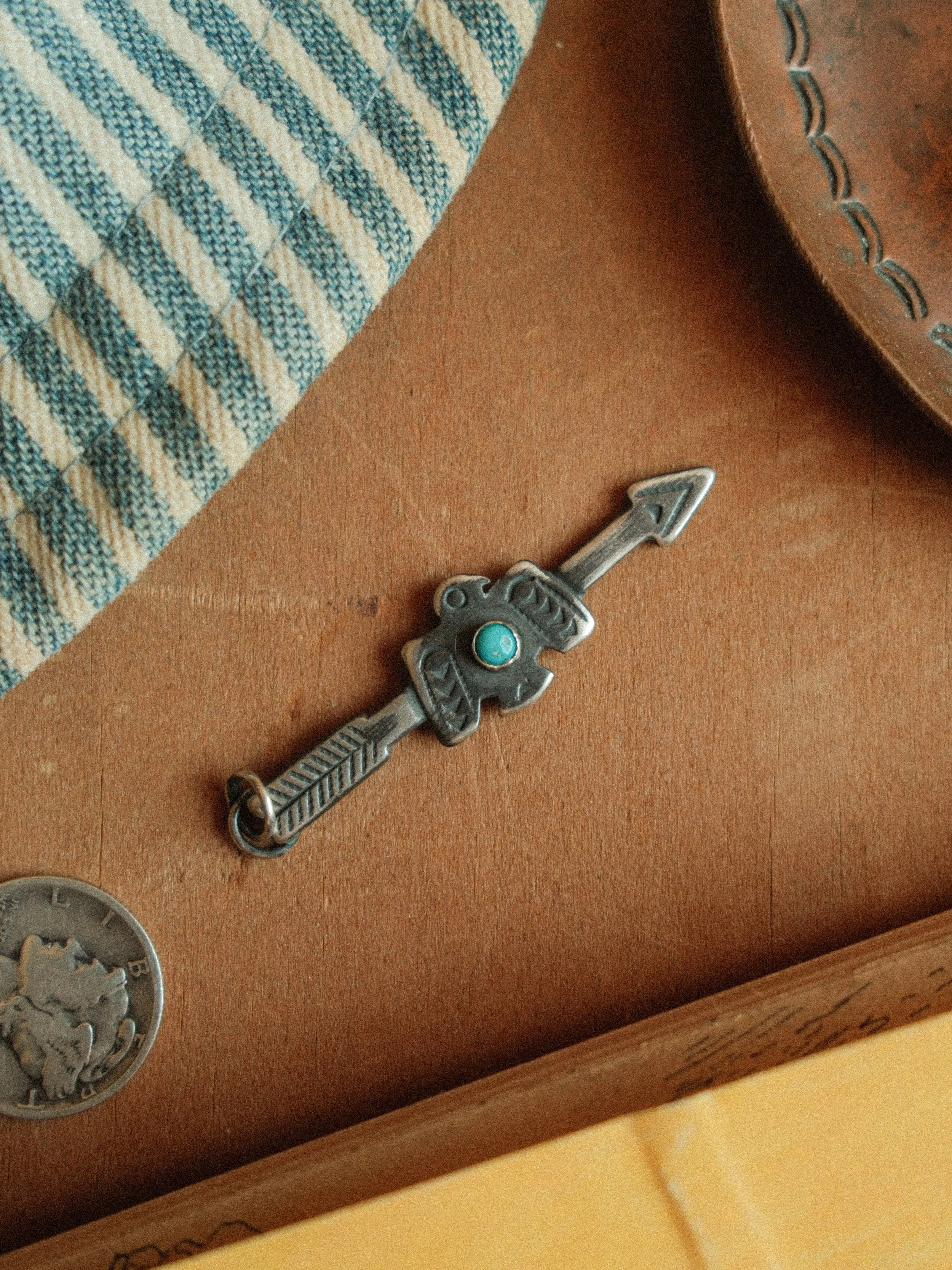 Arrow and thunderbird joined in fine sterling stampwork, centered with Carico Lake turquoise or a silver concho — view 4