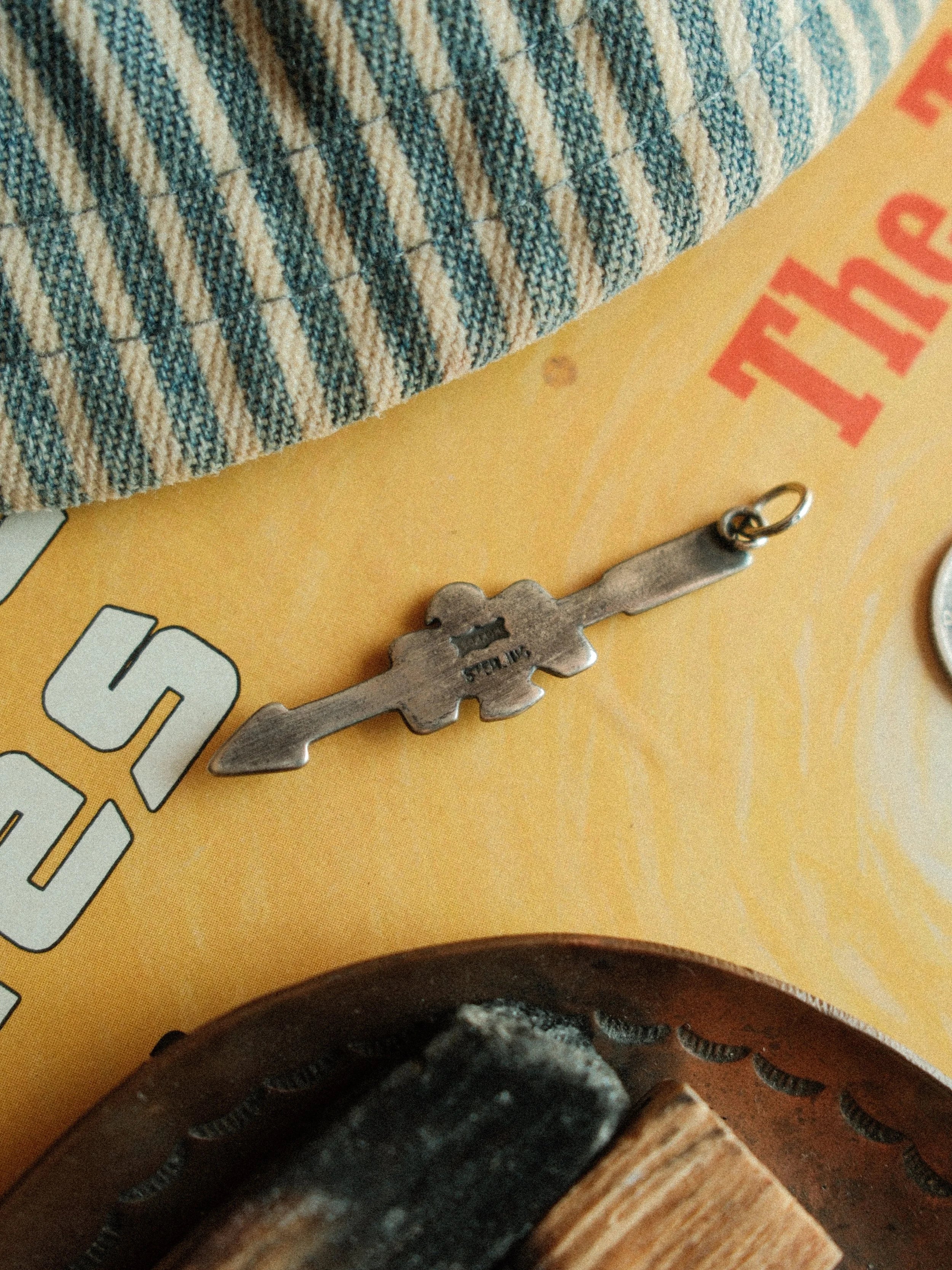 Arrow and thunderbird joined in fine sterling stampwork, centered with Carico Lake turquoise or a silver concho — view 7