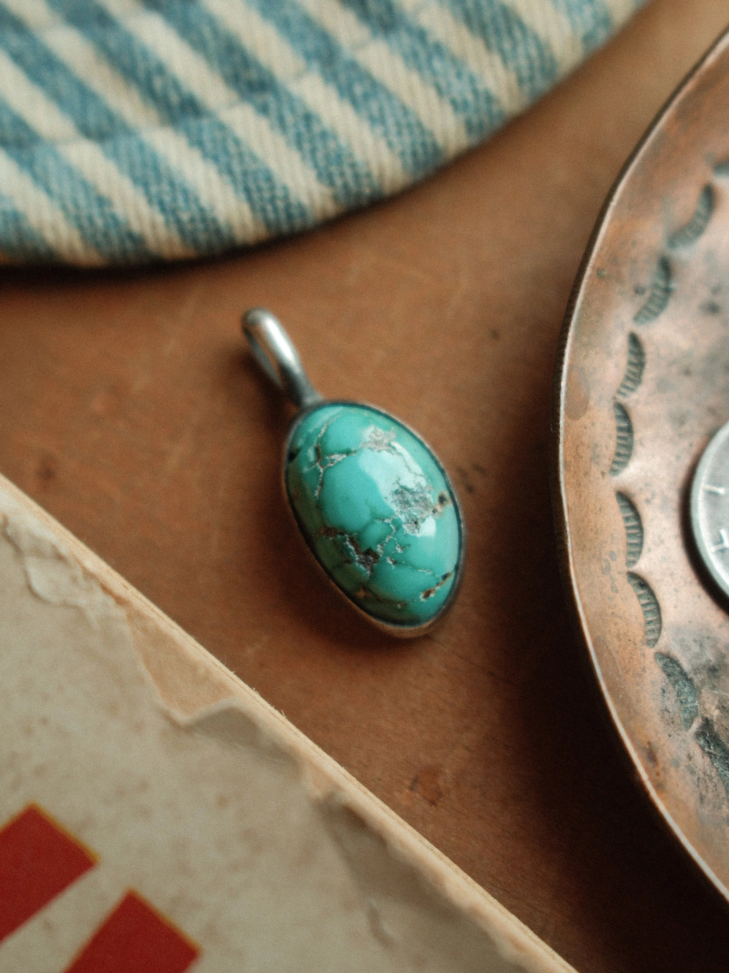 Natural Nevada Fox turquoise, 12×18mm, in a clean sterling bezel with our signature patina