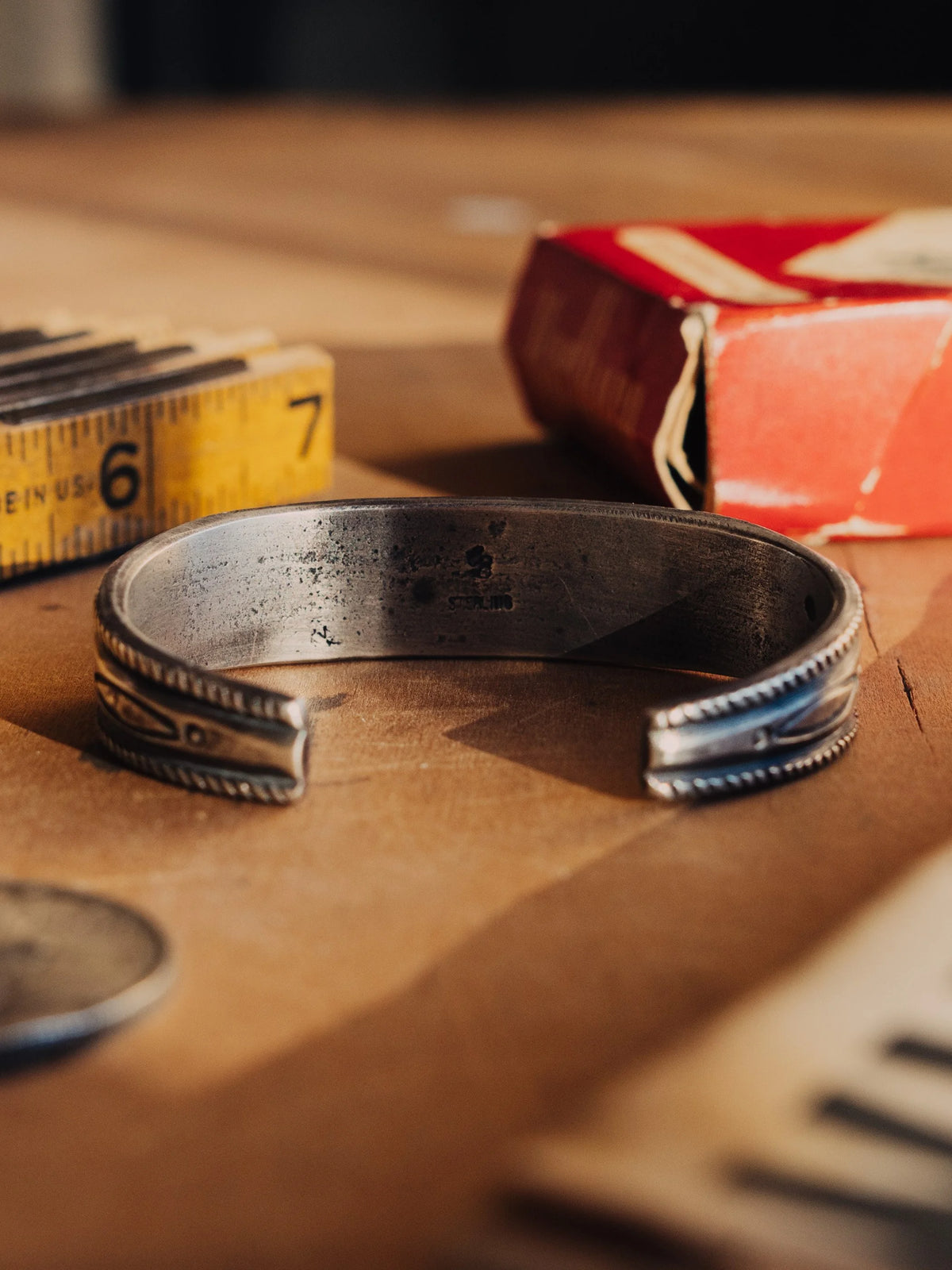 A tufa-cast ingot cuff intricately hand-stamped and set with a deep piece of Manassa turquoise from Colorado's dormant King mine — view 3