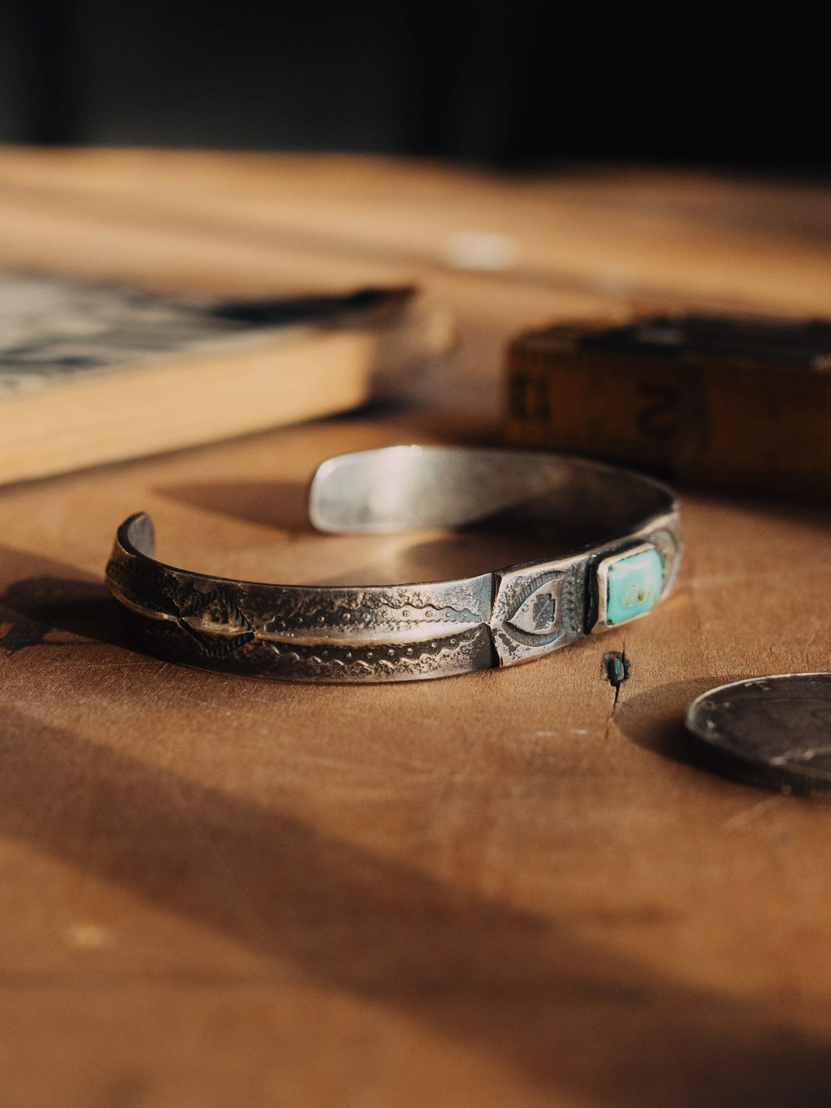 A coin-silver ingot cuff, tufa-cast and hand-stamped, centered on a piece of Manassa turquoise from Colorado — view 2