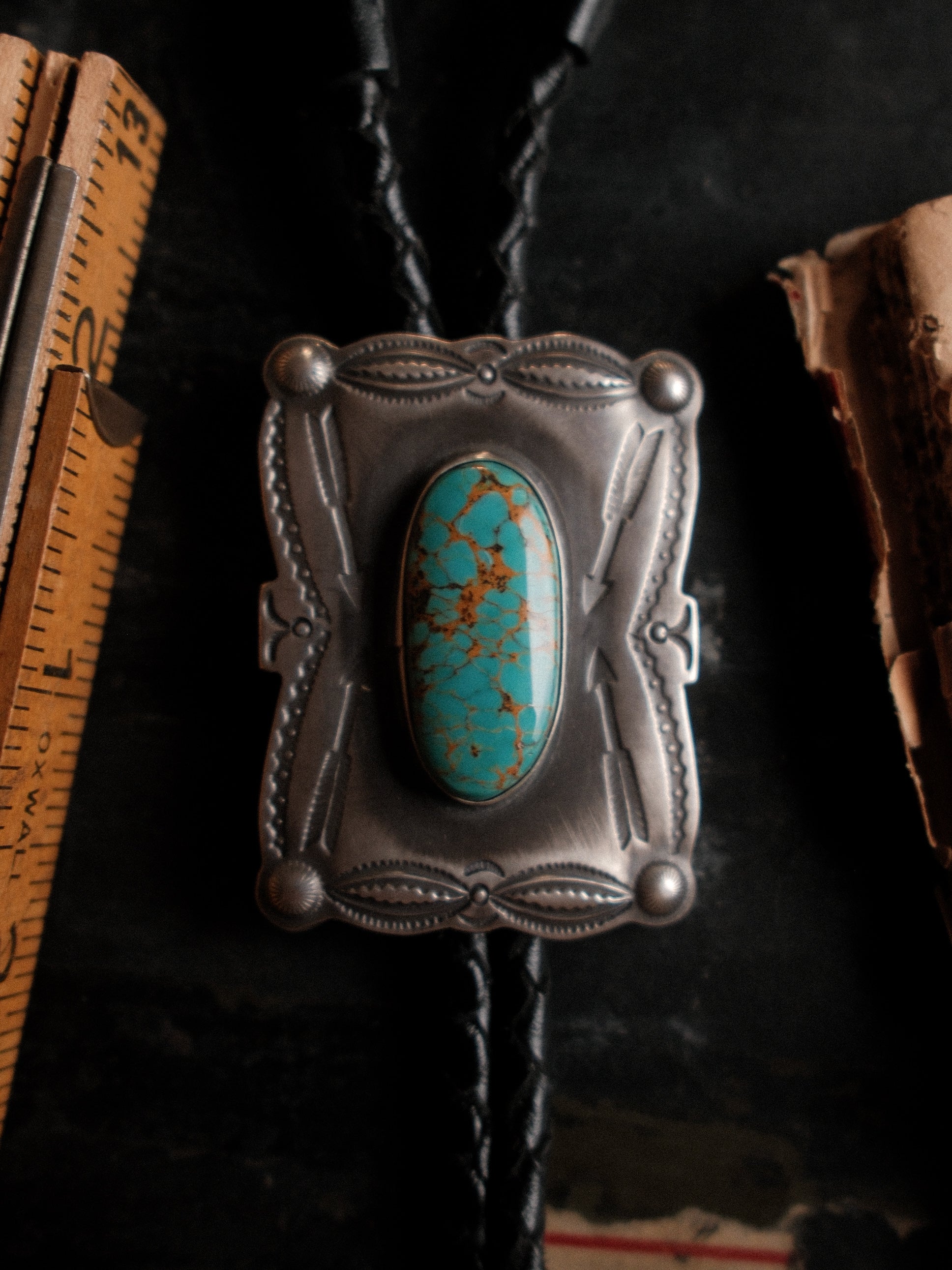 Nevada Royston turquoise on a hand-stamped sterling slide with braided leather cord — view 5