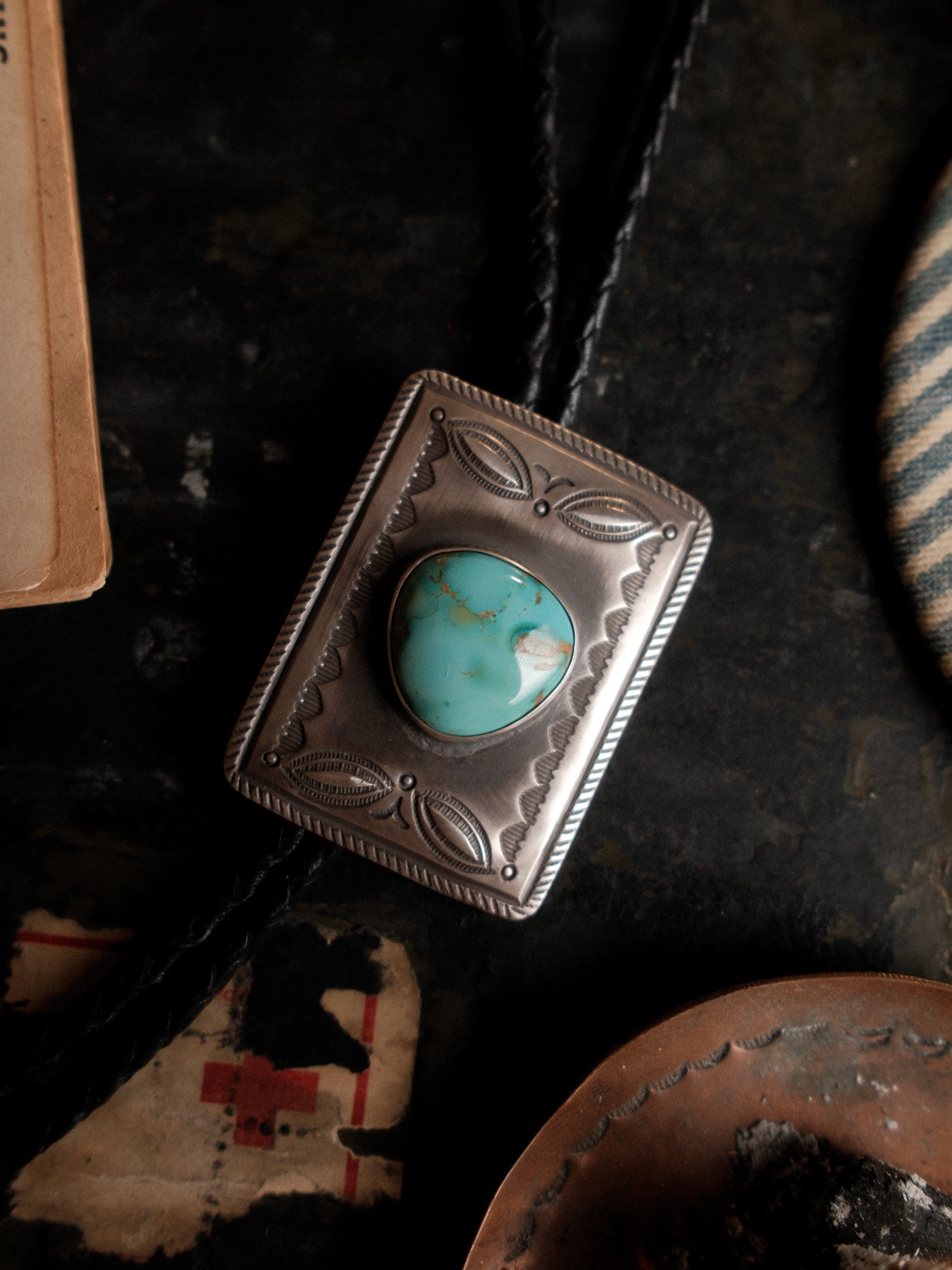 One of a kind: Royston turquoise hand-set in stamped sterling on braided leather, finished with sterling end tips