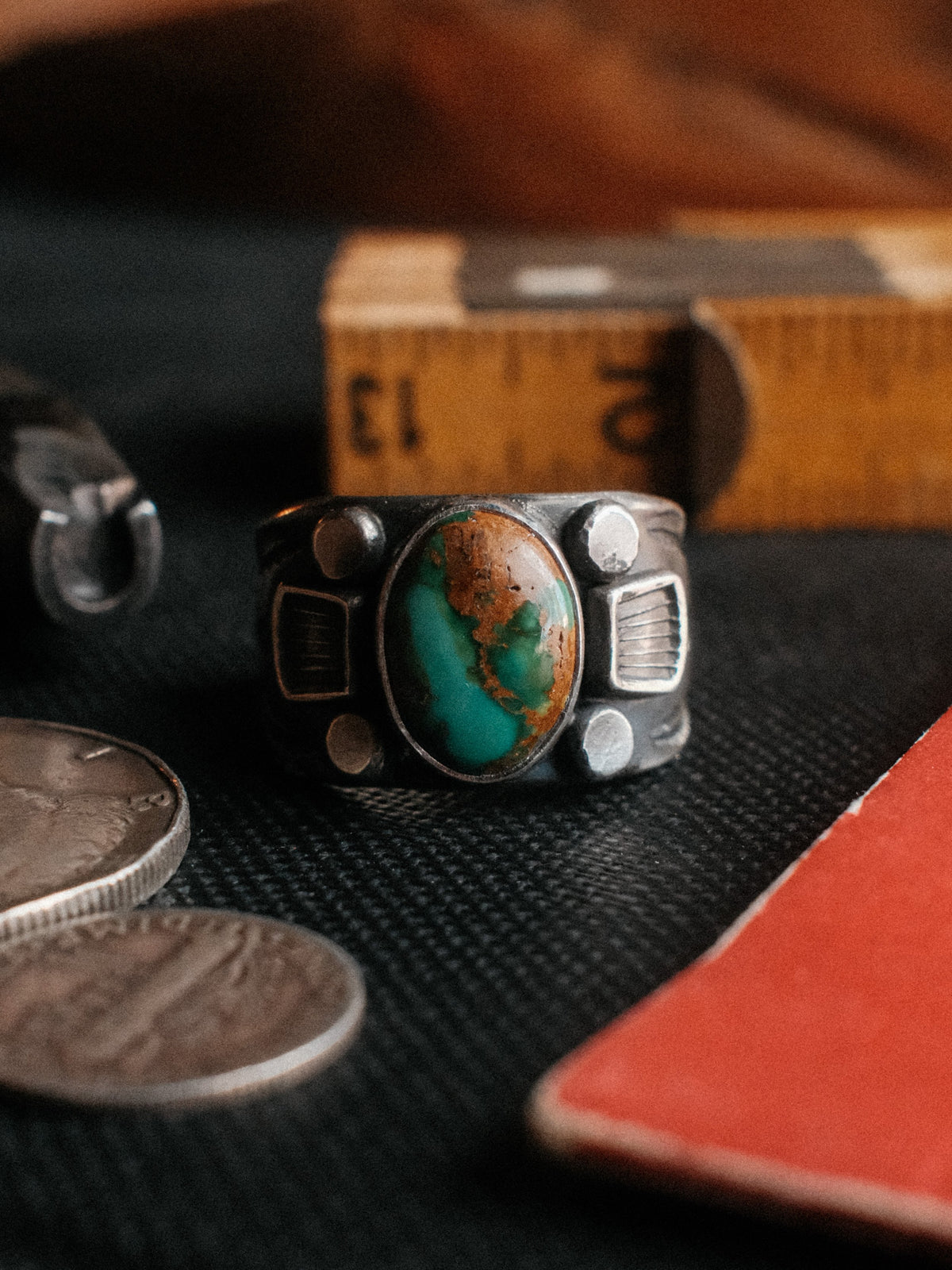 A sturdy Bandolero shank dressed in sterling stampwork and beadwork, set with Royston turquoise from Nevada