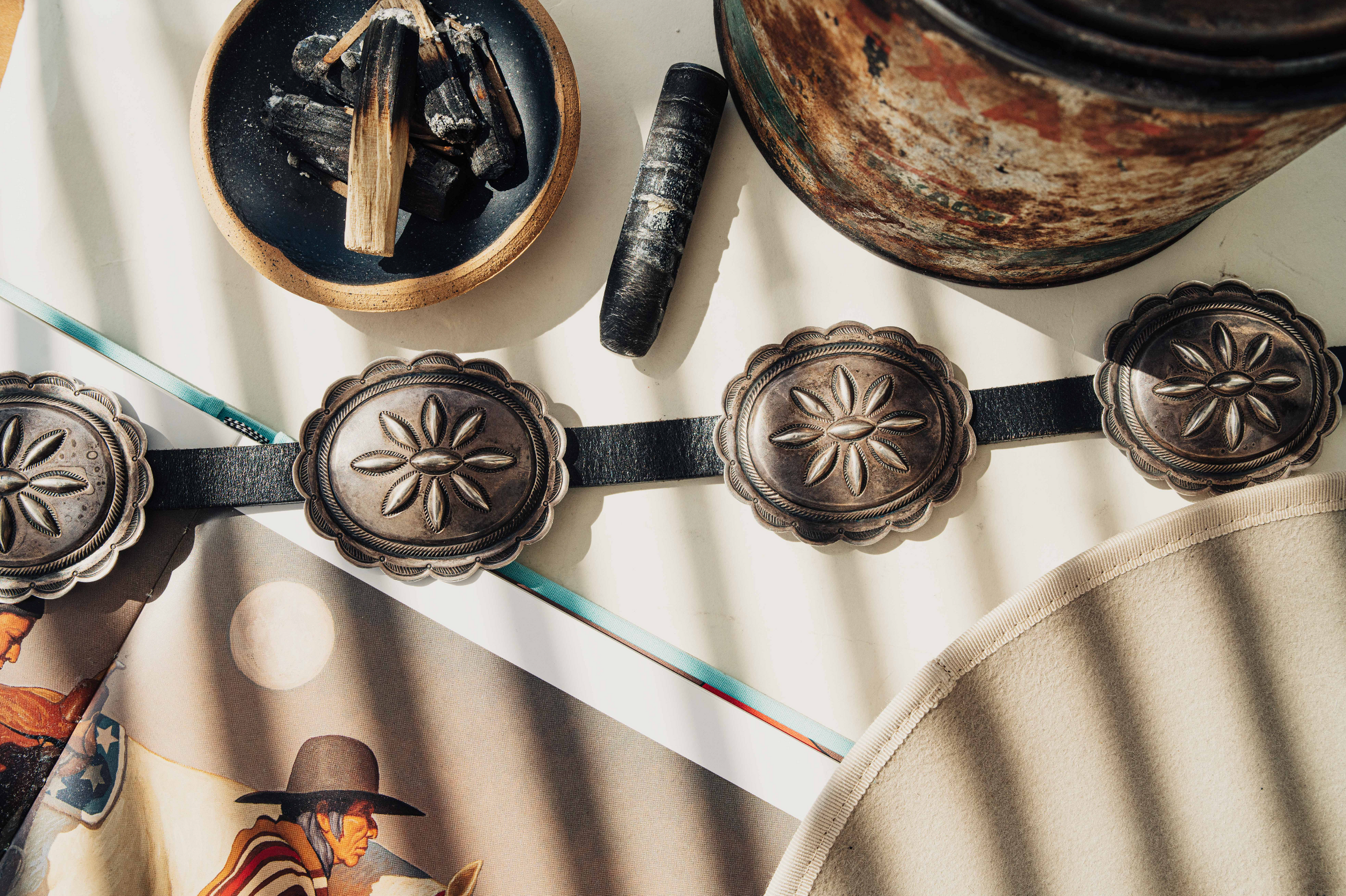 A vintage handmade concho belt — eight sterling silver conchos on black leather with a natural patina earned over decades — view 4