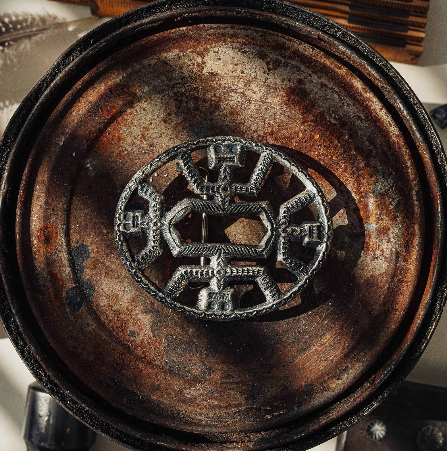 A kachina-motif sandcast buckle in sterling silver, deeply stamped and handmade by Roland Dixson — view 4