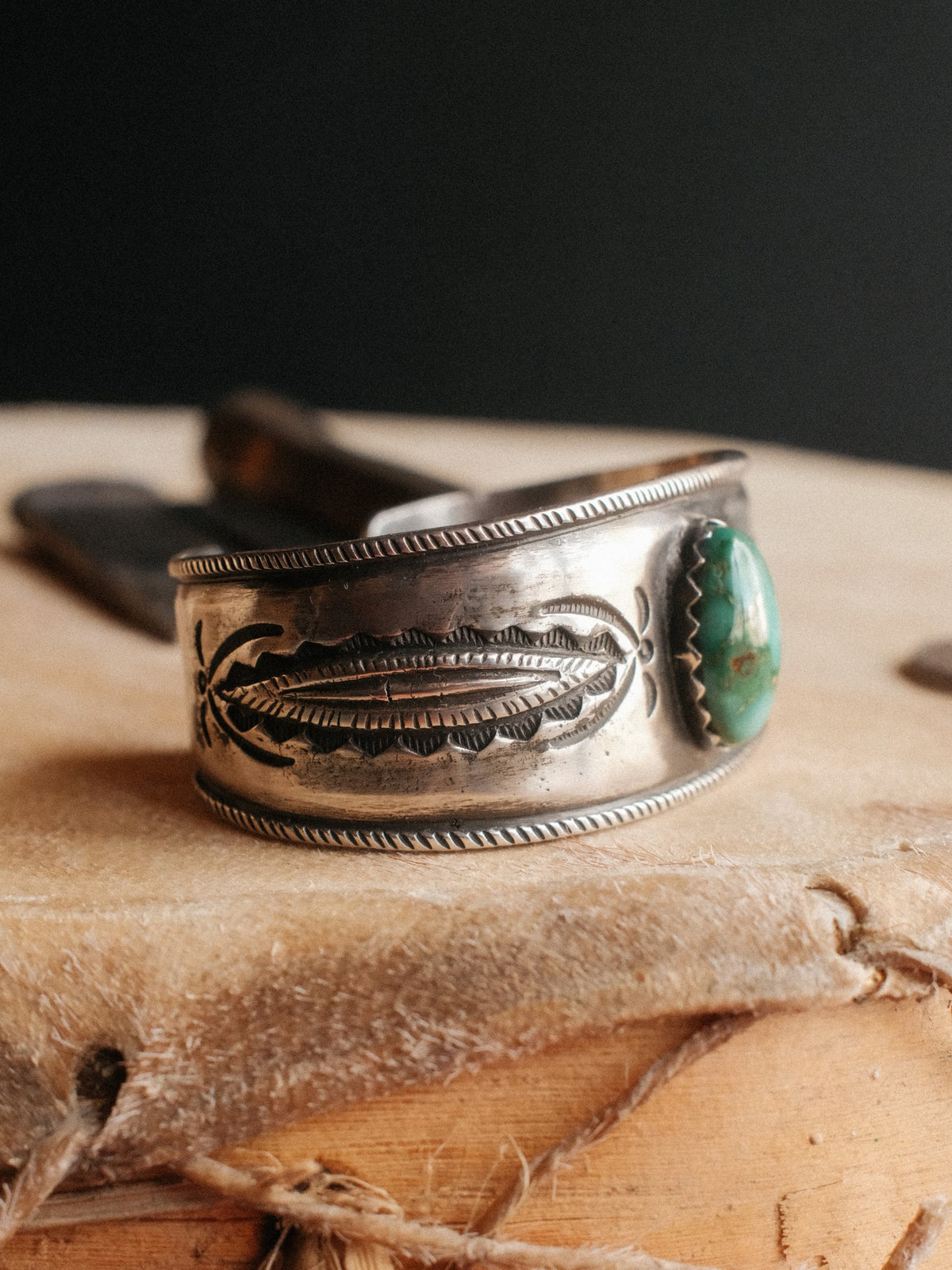 A tufa-cast ingot cuff set with Royston turquoise and hand-stamped with Chad's own steel — view 2