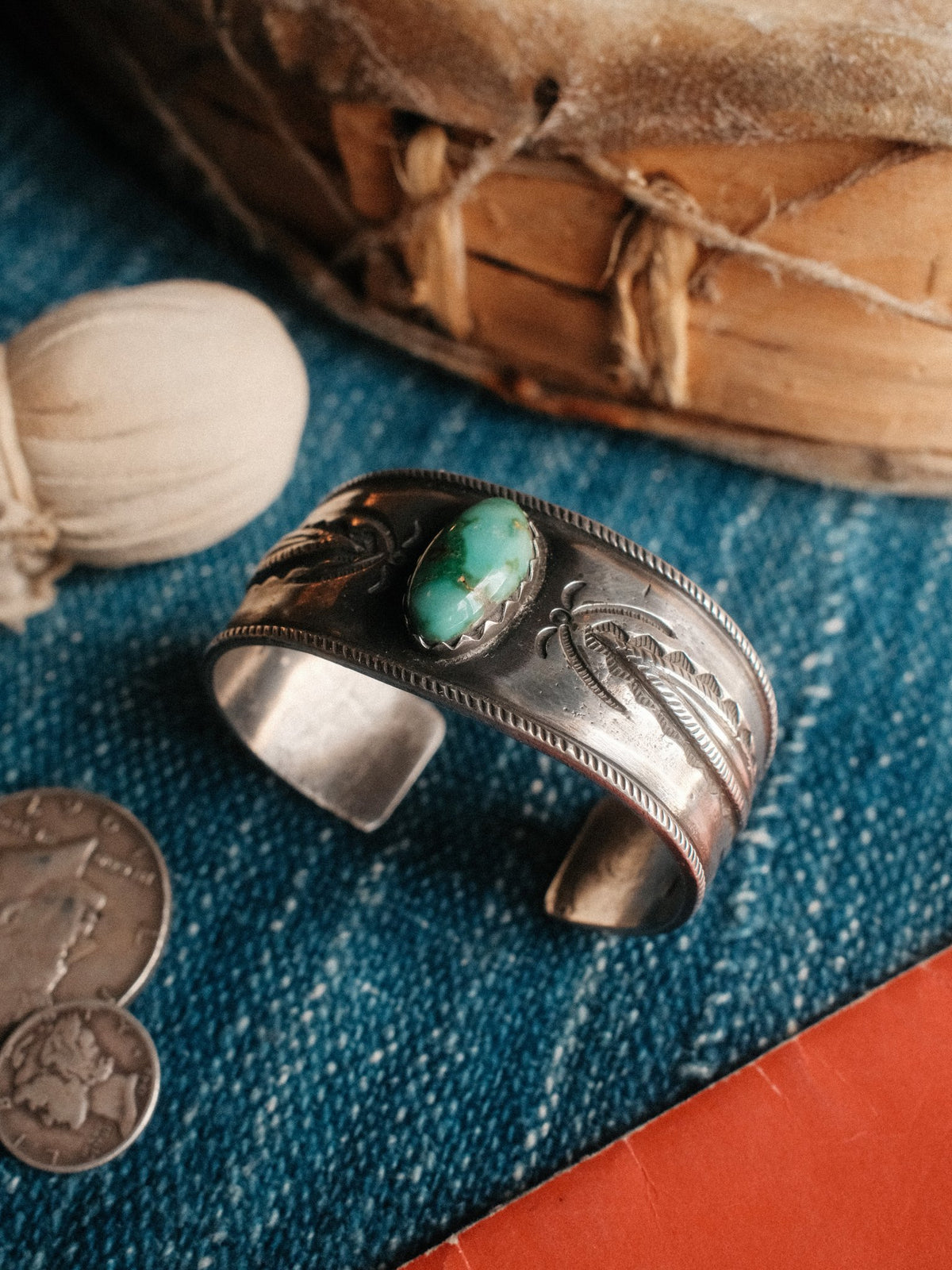 A tufa-cast ingot cuff set with Royston turquoise and hand-stamped with Chad's own steel — view 3