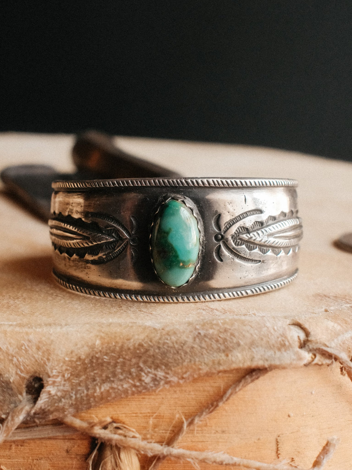 A tufa-cast ingot cuff set with Royston turquoise and hand-stamped with Chad's own steel — view 4