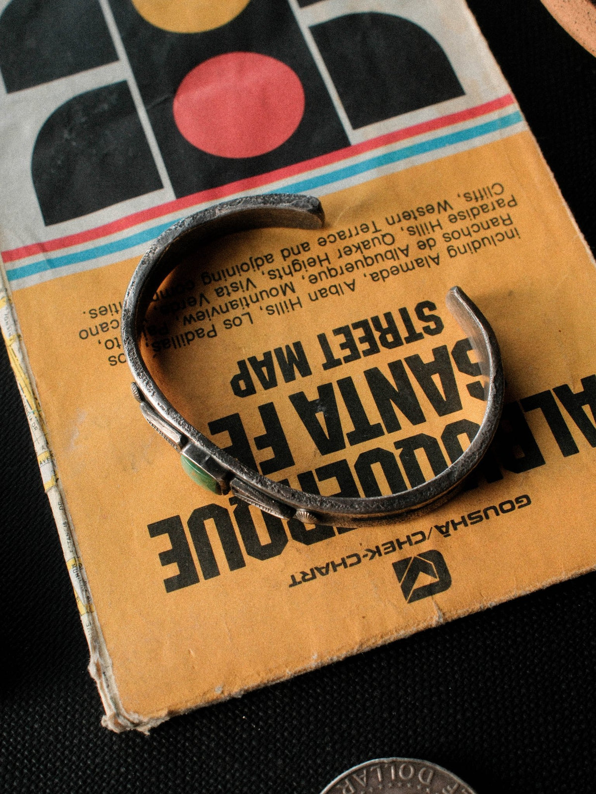 A heavier tufa-cast ingot cuff in sterling, hand-stamped and set with Royston turquoise from Nevada — view 4