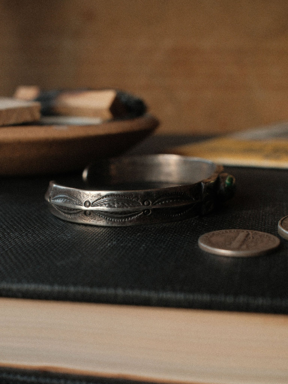 Poured from a tufa-cast ingot and worked flat across the top, this cuff is hand-stamped and set with Royston turquoise from Nevada — view 3