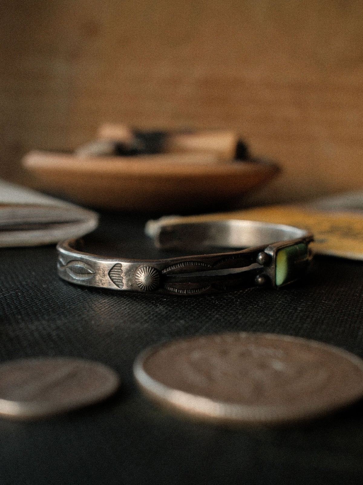 A tufa-cast split cuff hand-stamped with Chad's own steel and set with Royston turquoise — view 3