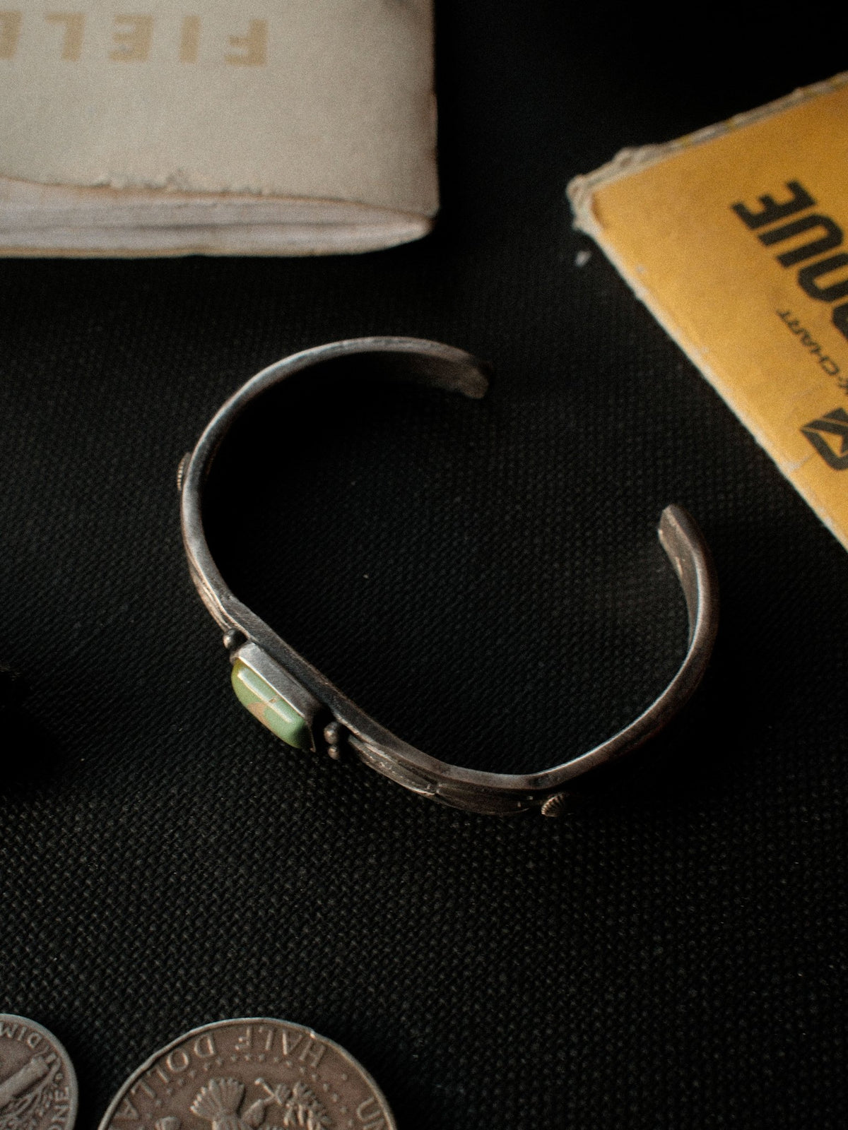 A tufa-cast split cuff hand-stamped with Chad's own steel and set with Royston turquoise — view 4