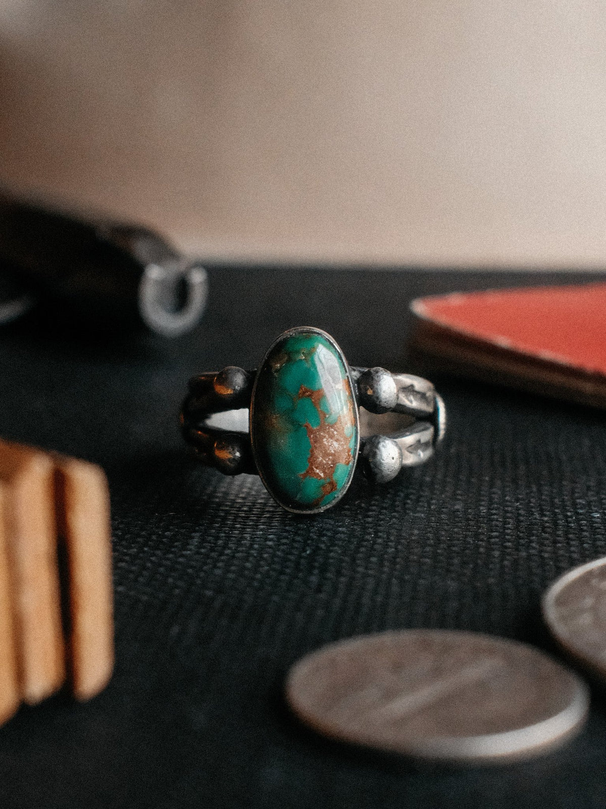 A two-prong split shank dressed in sterling conchos and beadwork, hand-stamped and set with Royston turquoise from Nevada